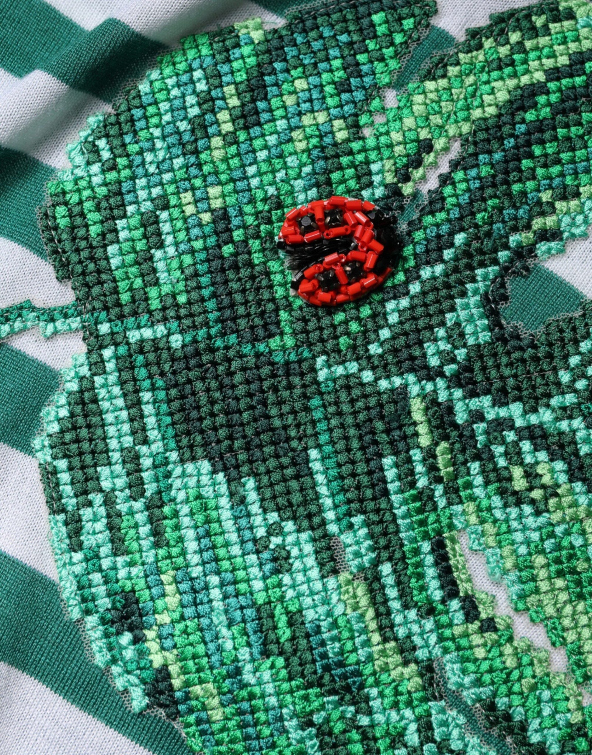 Embroidered leaf design on fabric
