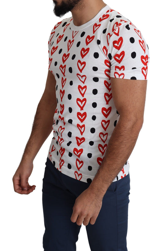 Man wearing a short sleeve shirt with hearts and polka dots