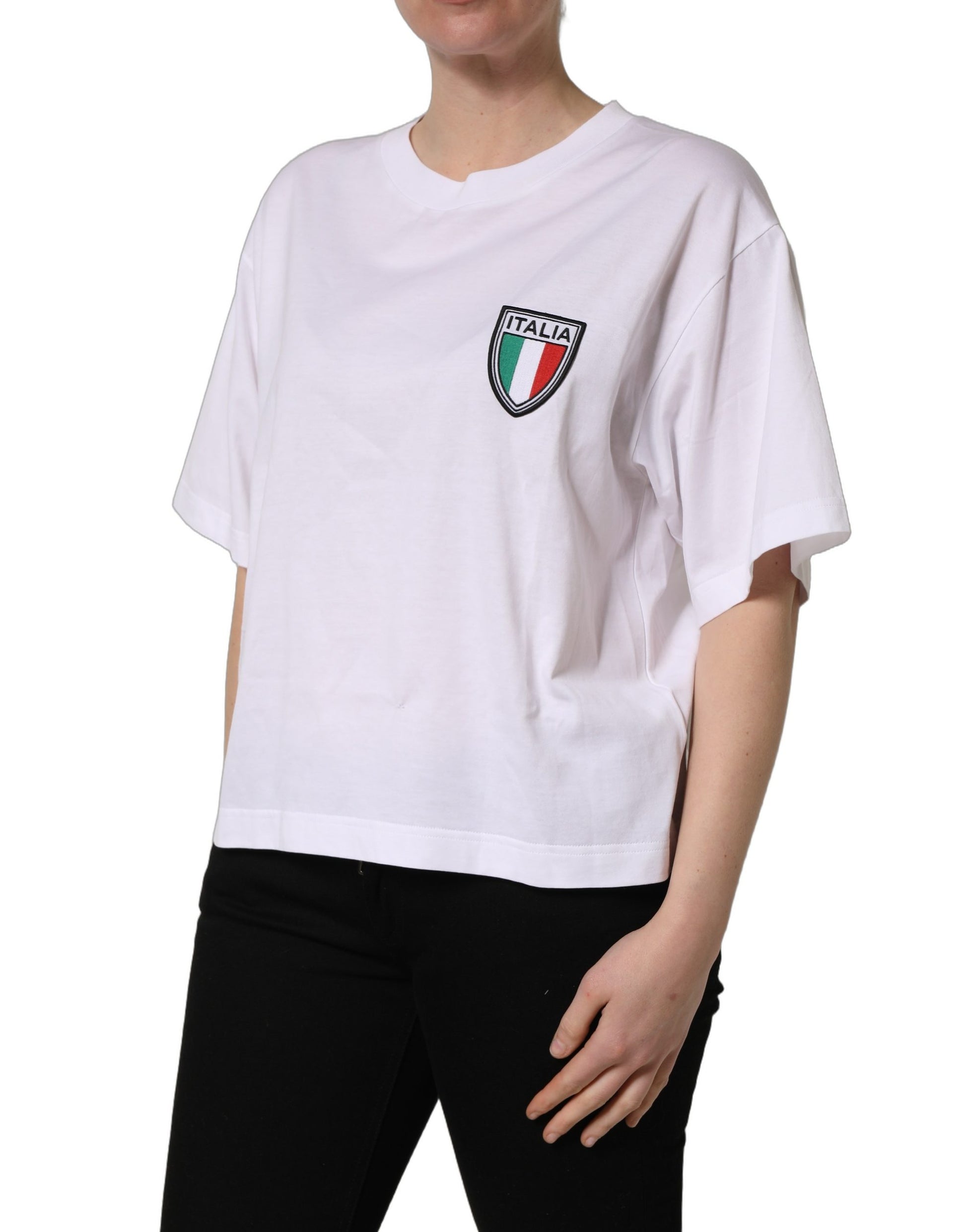 A white t-shirt with a patch of the Italian flag on the left chest area