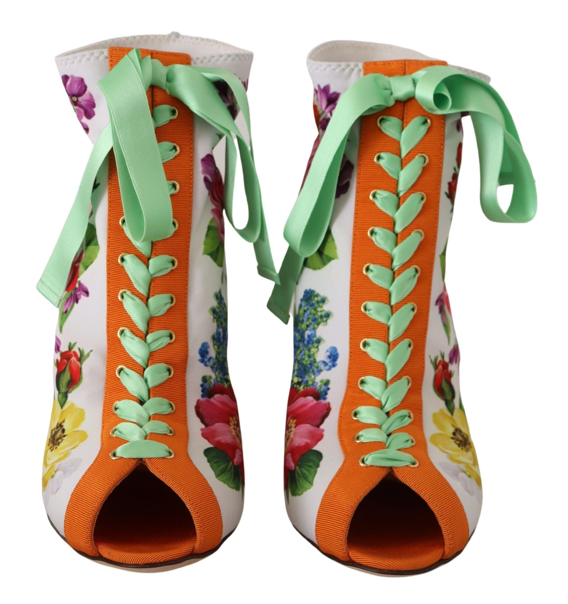 Pair of colorful children's boots with floral pattern and laces