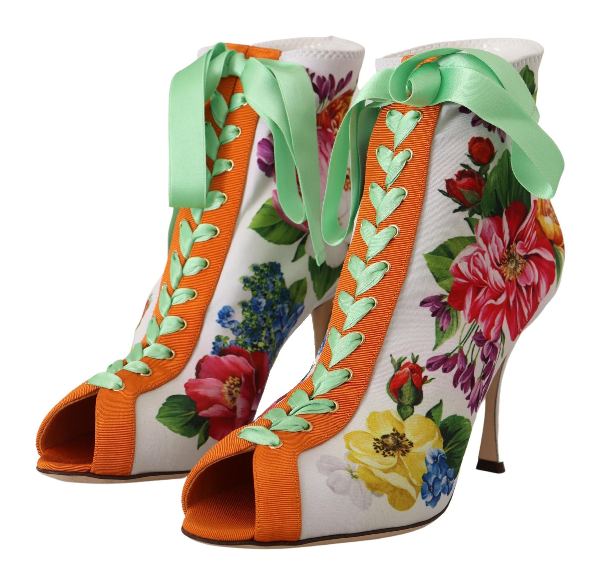 Pair of high heel shoes with floral print and green ribbon detailing