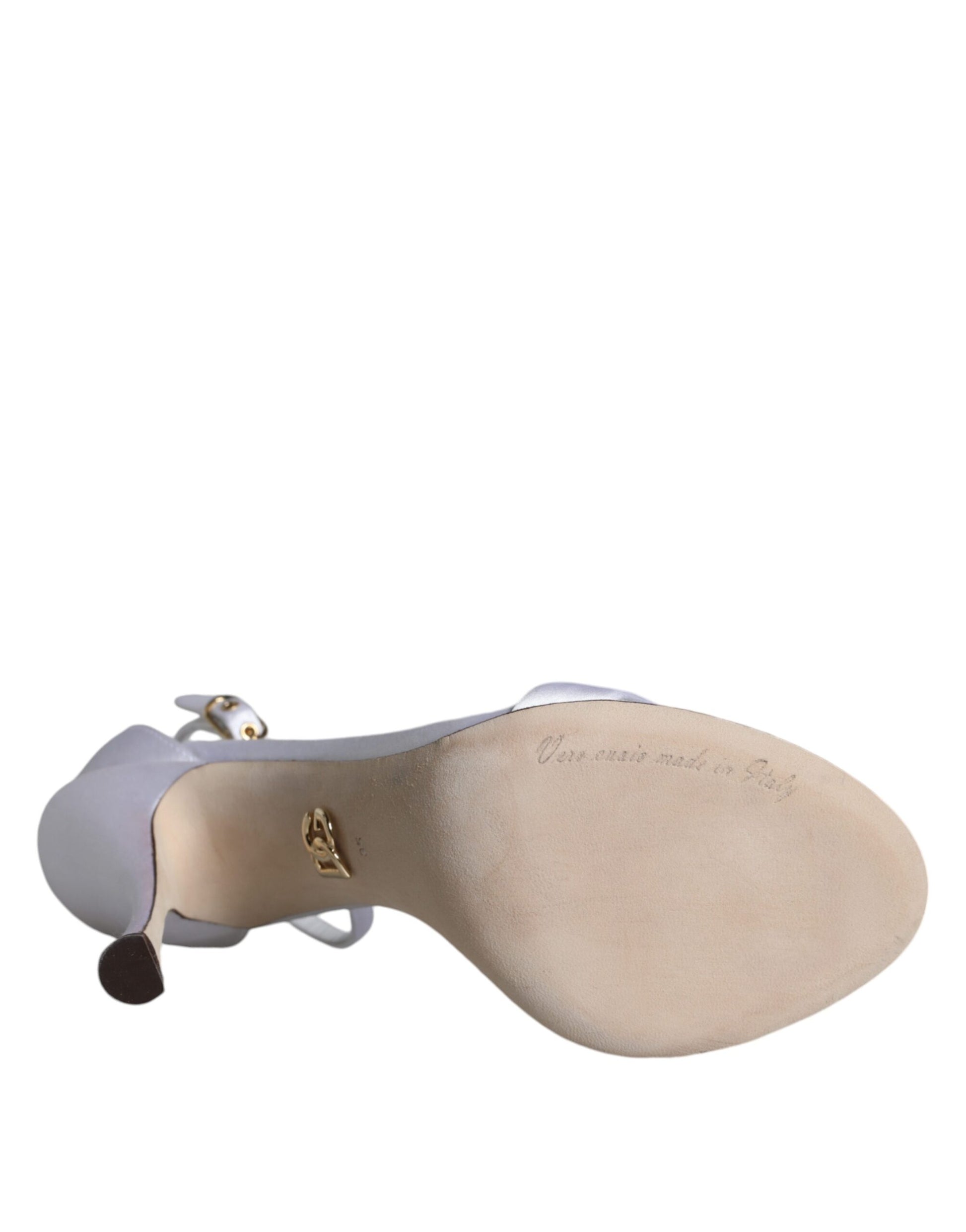 Tan shoe with gold buckle