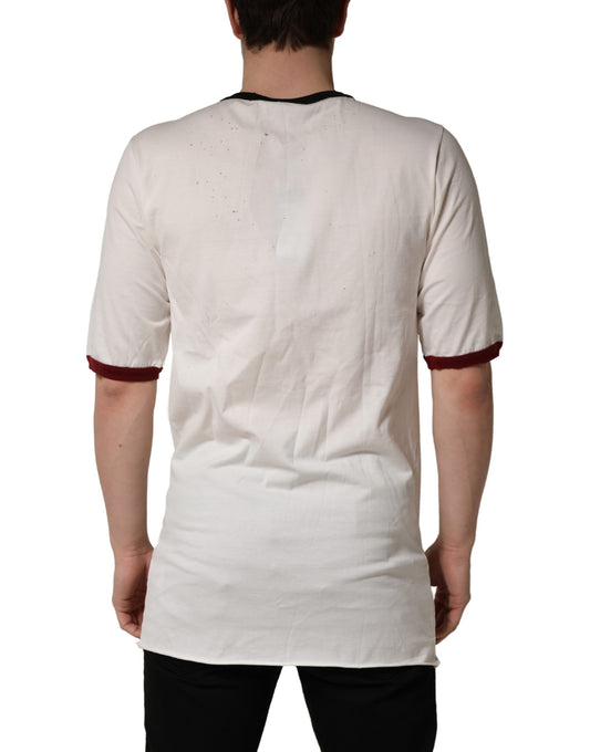 A white jersey t-shirt with a king of love print on the back