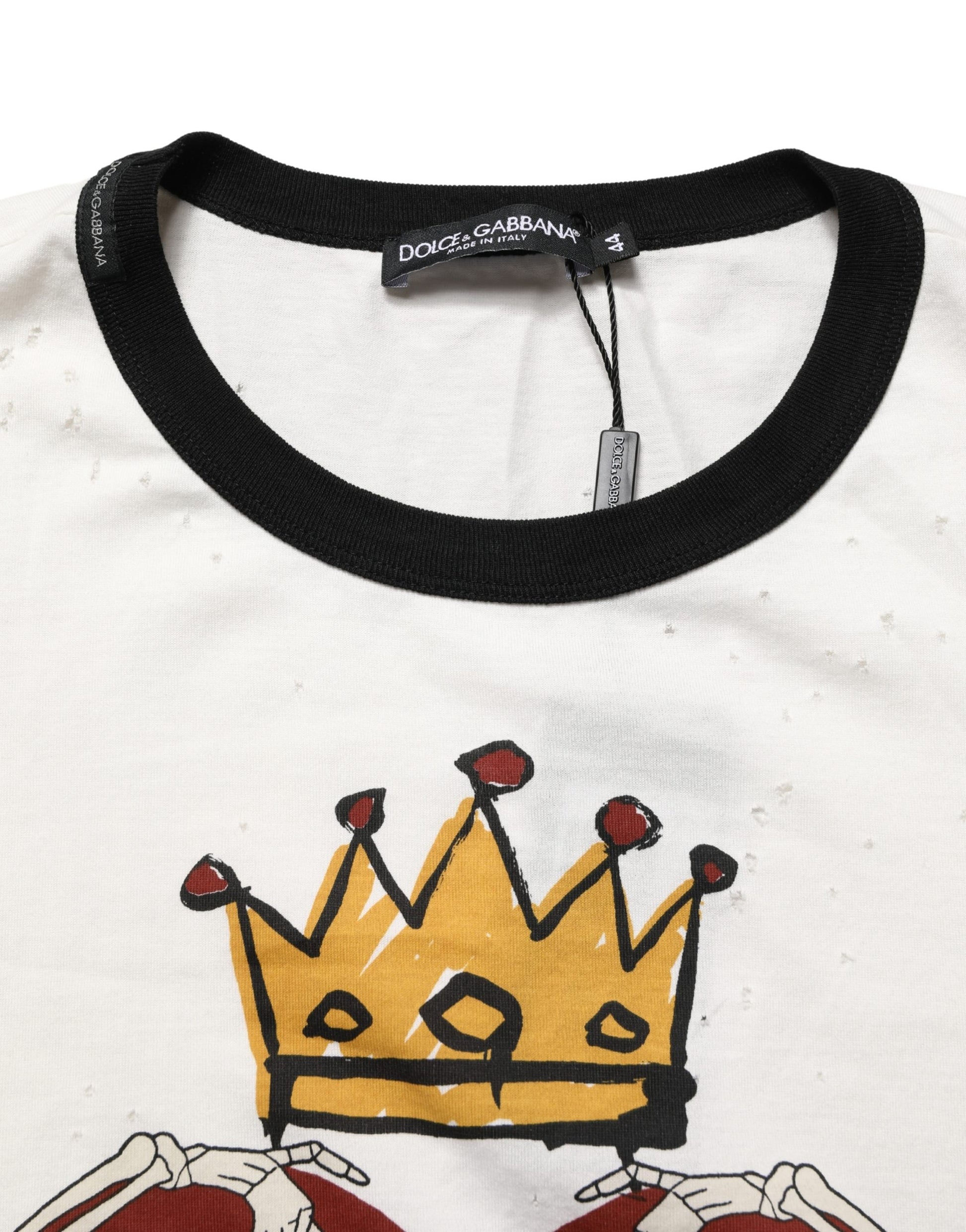 A white t-shirt with a graphic print of a king's crown and heart