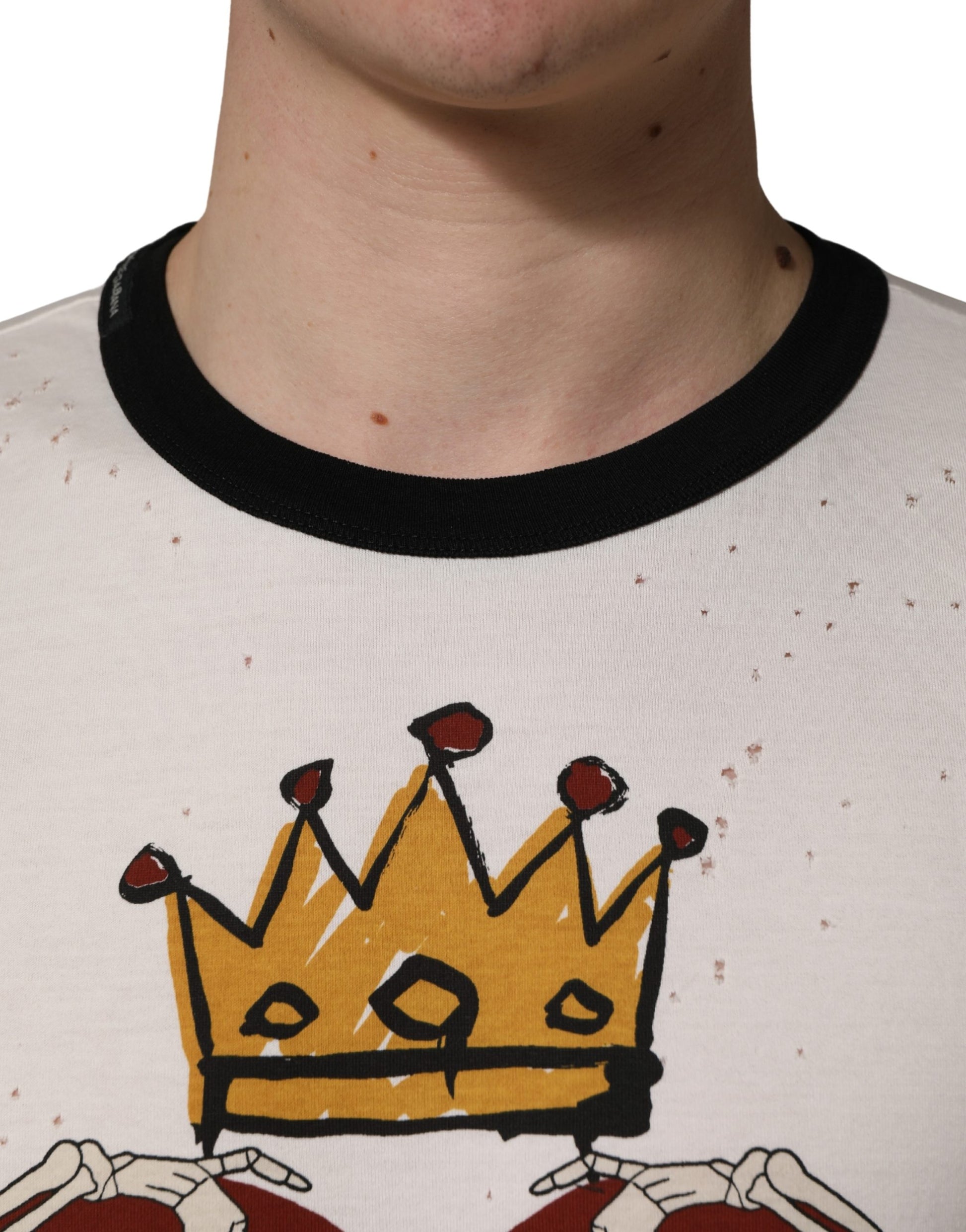 A white t-shirt with a graphic print of a king's crown and heart