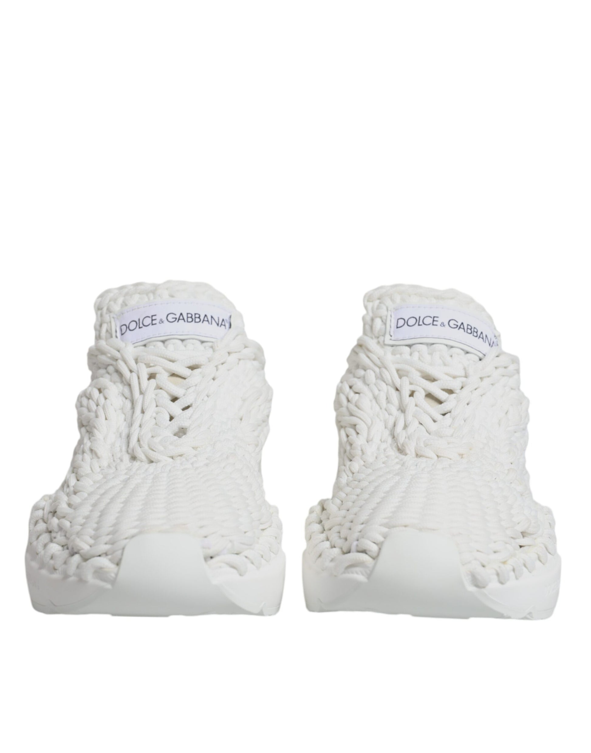 Pair of white knitted sneakers with black text on side, featuring a unique design and brand logo