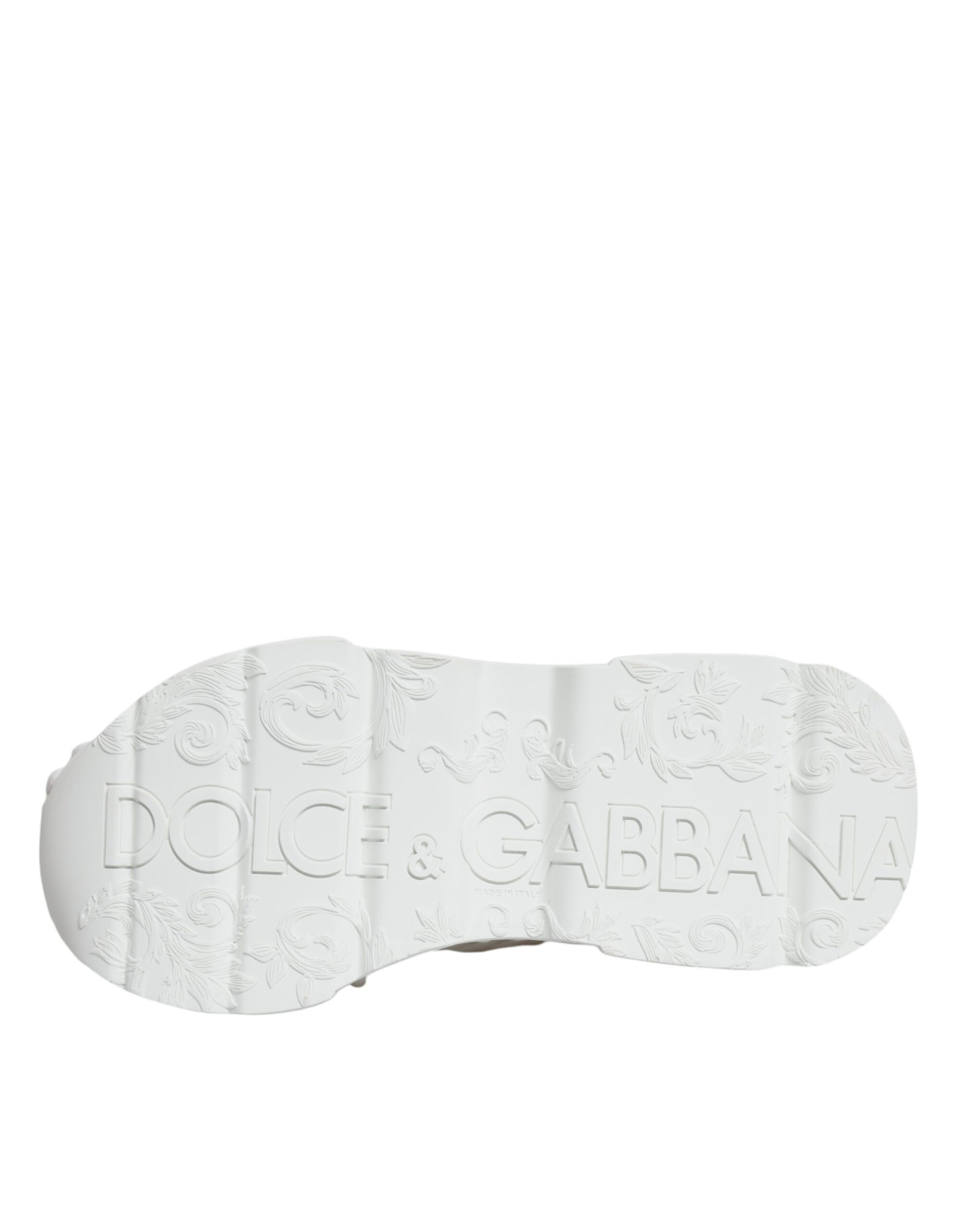 A pair of white knitted sneakers with a logo on the side, featuring the brand name "Dolce & Gabbana"