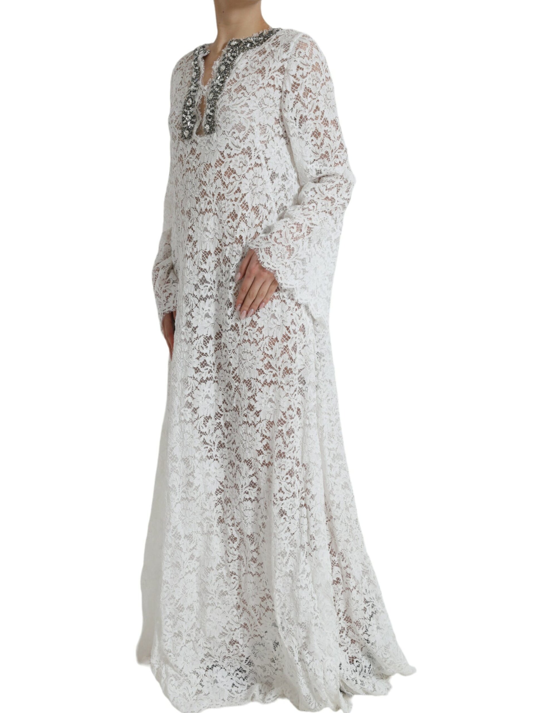 A long white lace dress with crystal embellishments and a shift silhouette