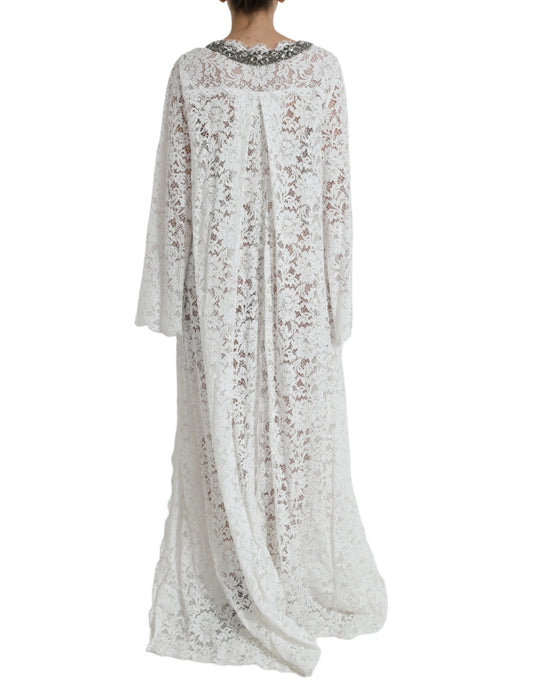 A white lace dress with crystal embellishments, featuring a shift silhouette