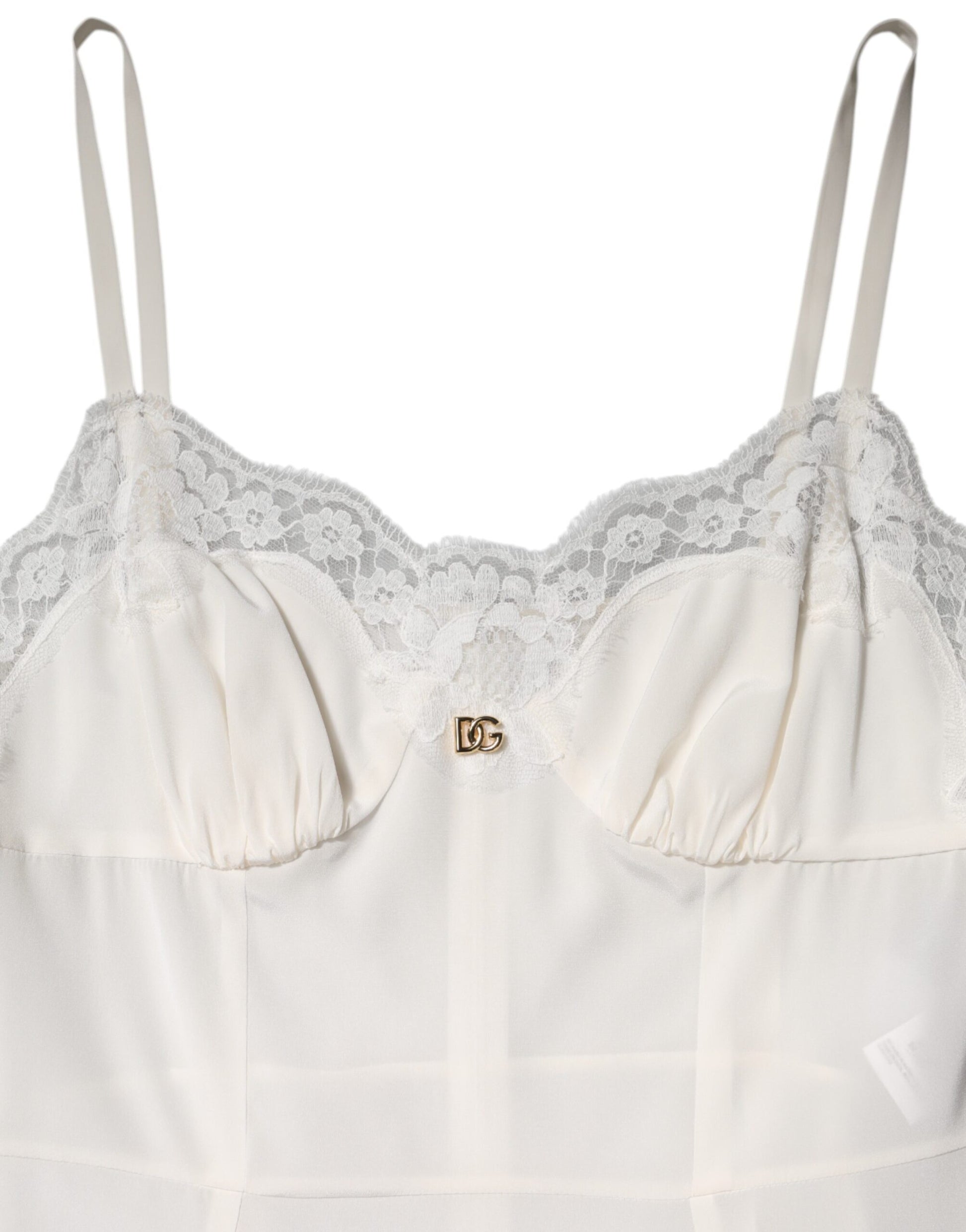 A white lace dress with a D&G logo on the chest