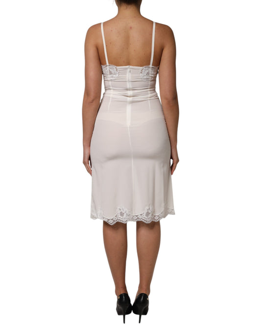 A white lace dress with a gold logo, featuring a silky texture and designed for sleepwear
