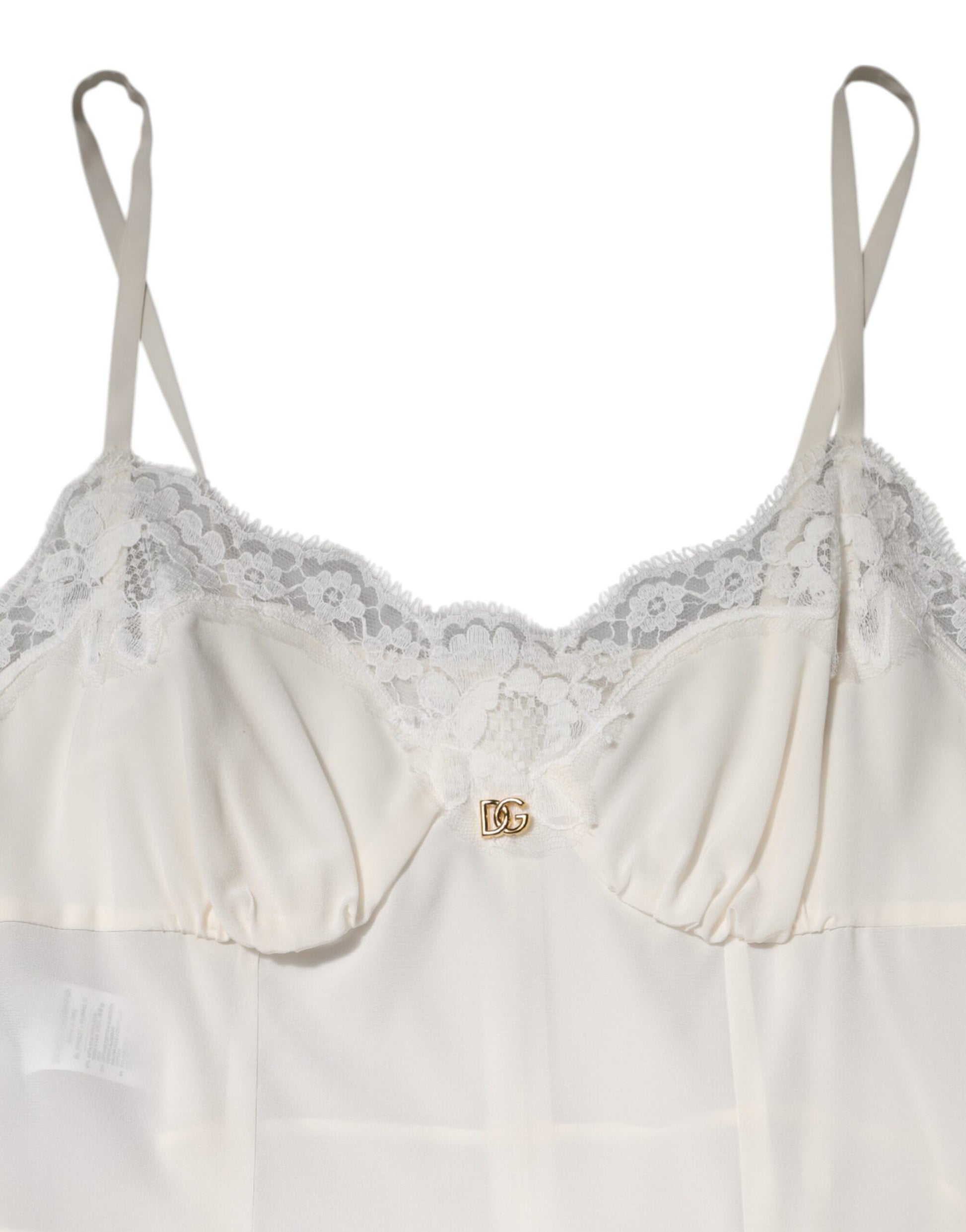 A white lace dress with a gold D&G logo on the chest