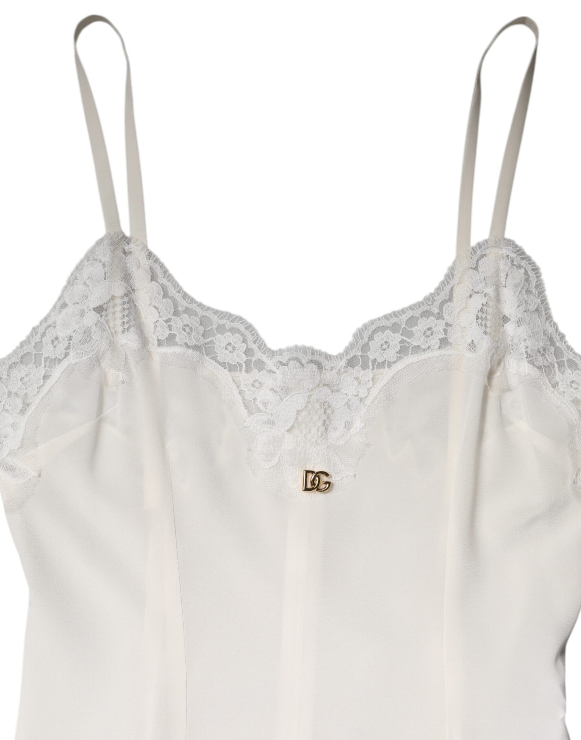 A white lace dress with a gold D&G logo on the chest
