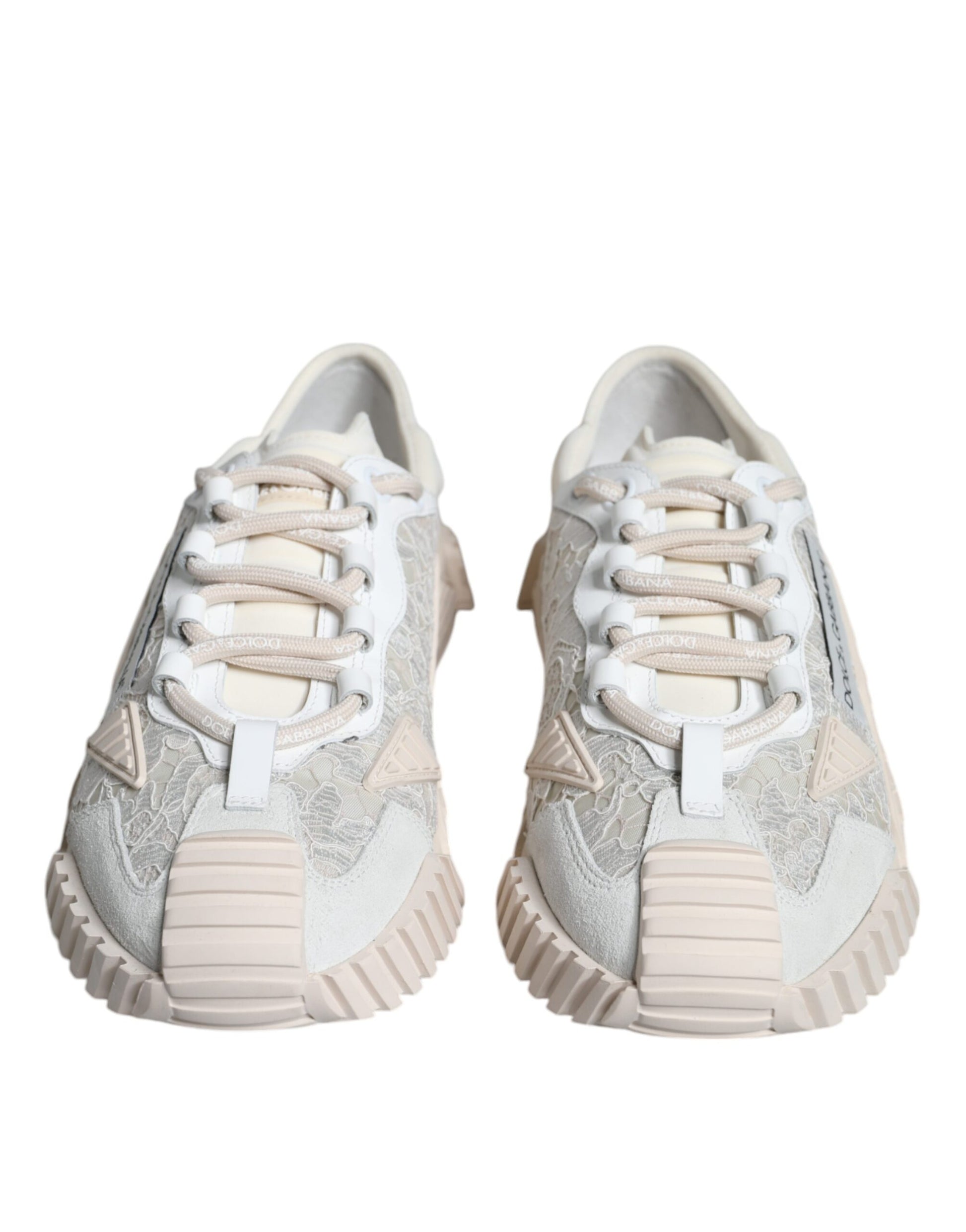Pair of white lace-up sneakers with a low top and chunky sole