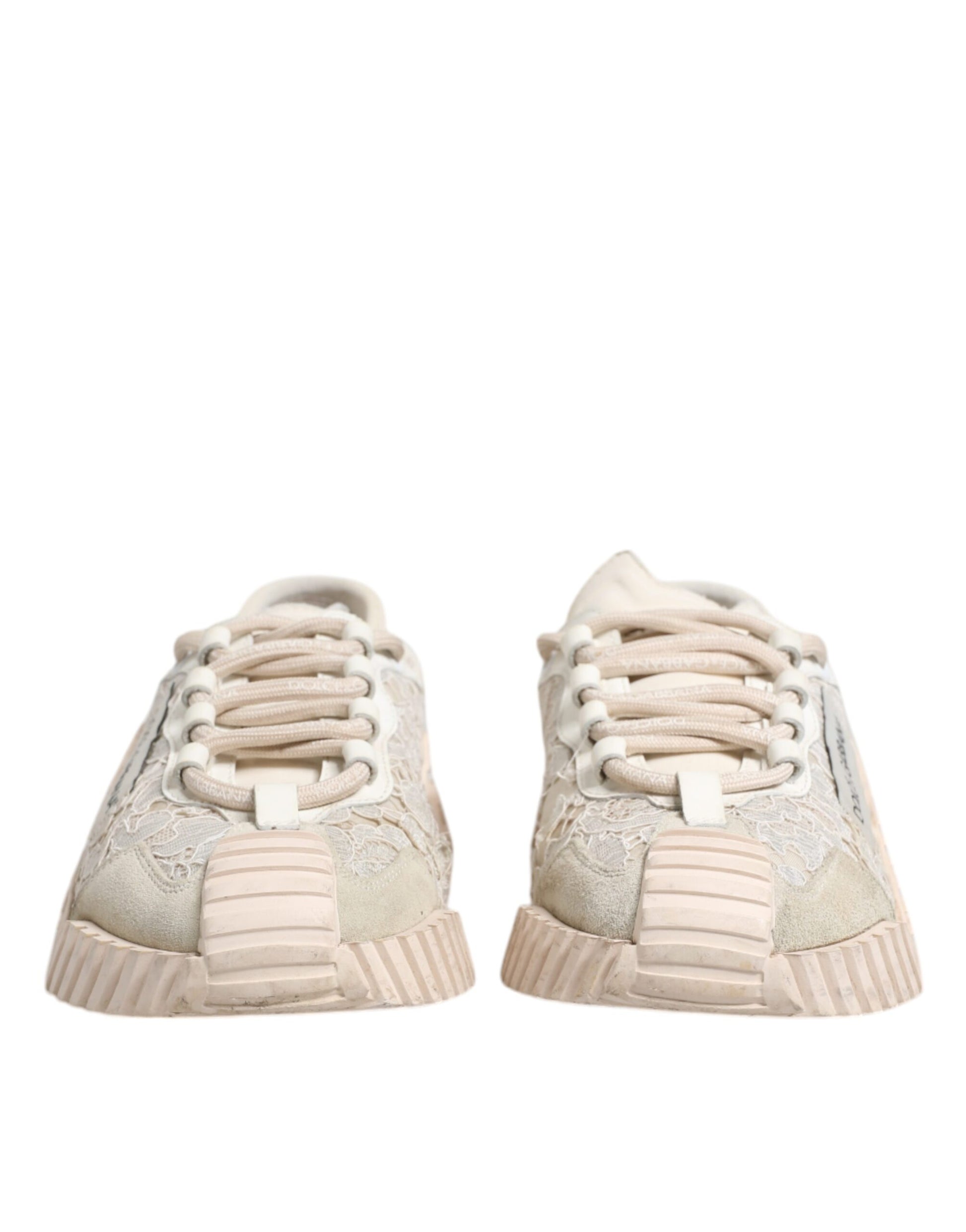 A pair of white lace-up sneakers with a low top, featuring a glittery design on the side and a chunky sole