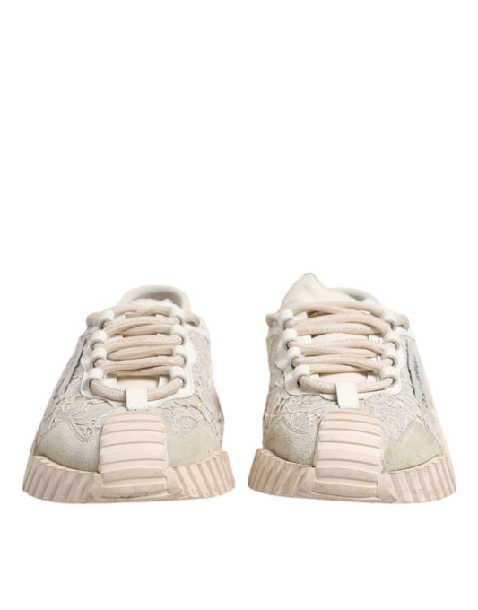 A pair of white lace-up sneakers with a low top, featuring a glittery design on the side and a chunky sole