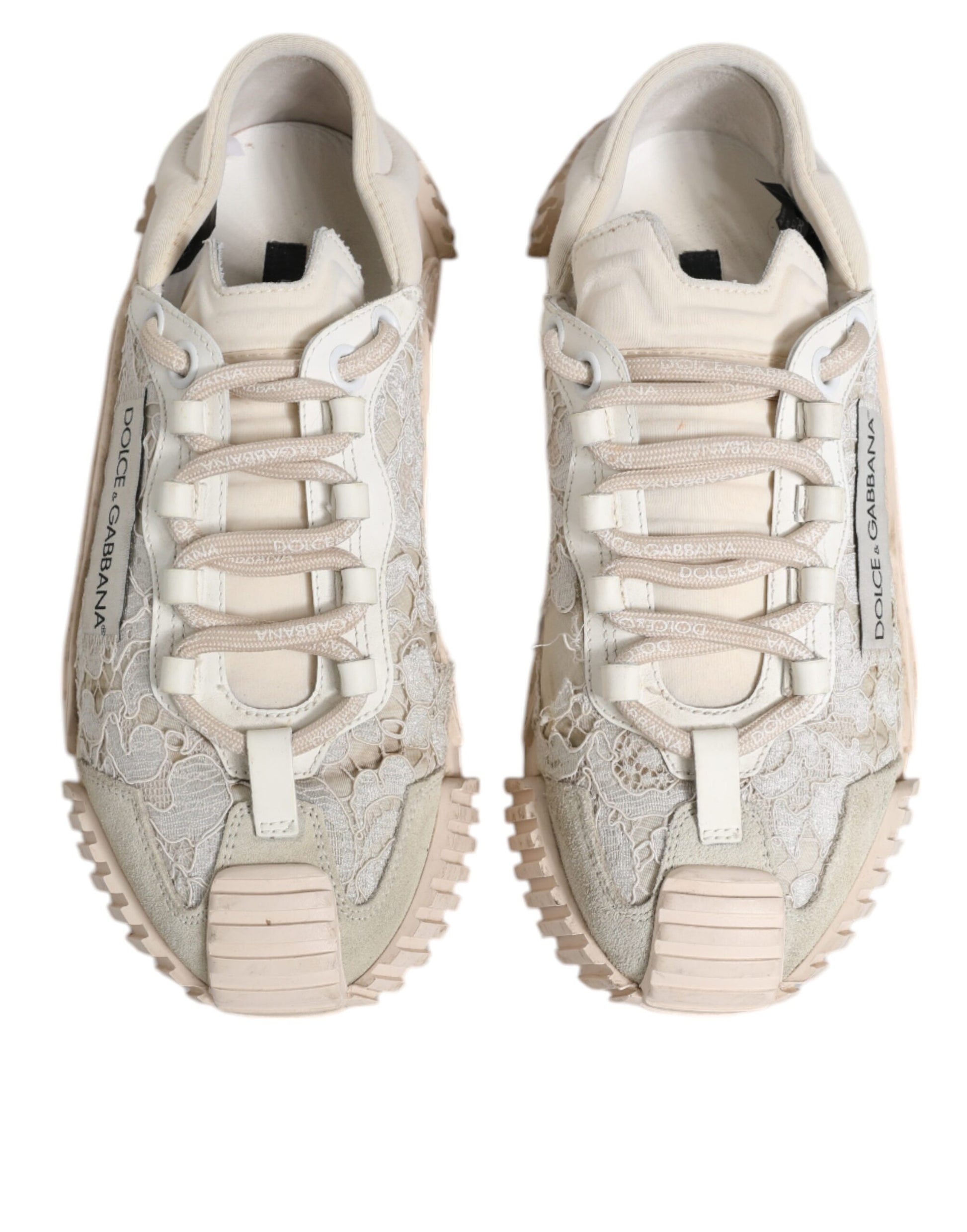 Pair of white lace-up sneakers with a textured upper and rubber sole