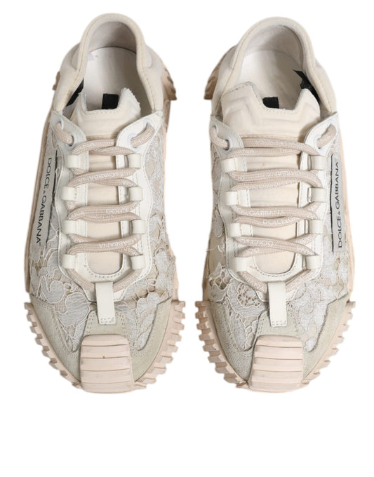 Pair of white lace-up sneakers with a textured upper and rubber sole