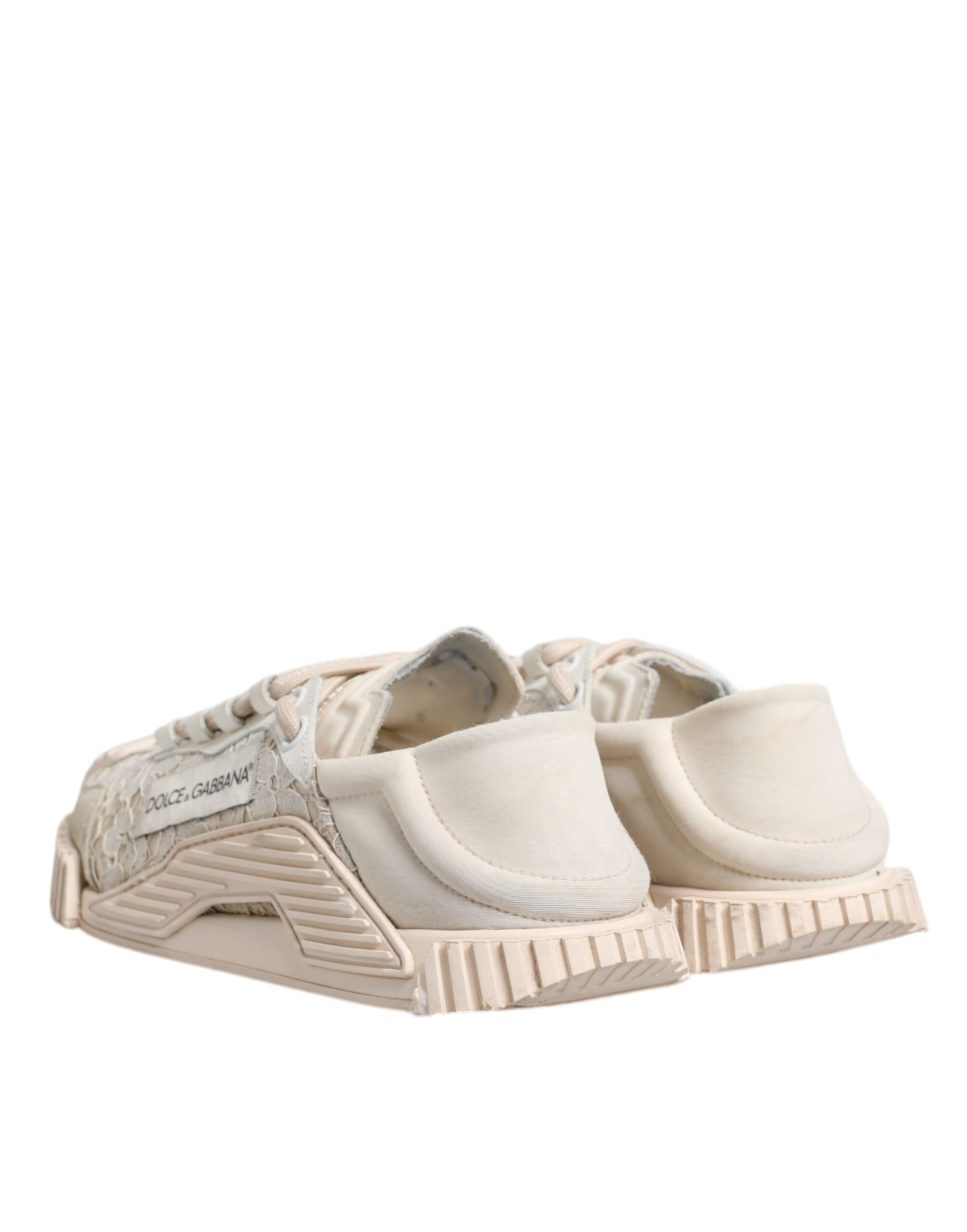 A pair of white lace-up sneakers with a low top, featuring a design that includes a patterned sole and a logo on the side