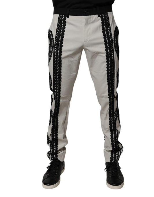 A pair of white lace trim mid waist dress pants by Dolce & Gabbana