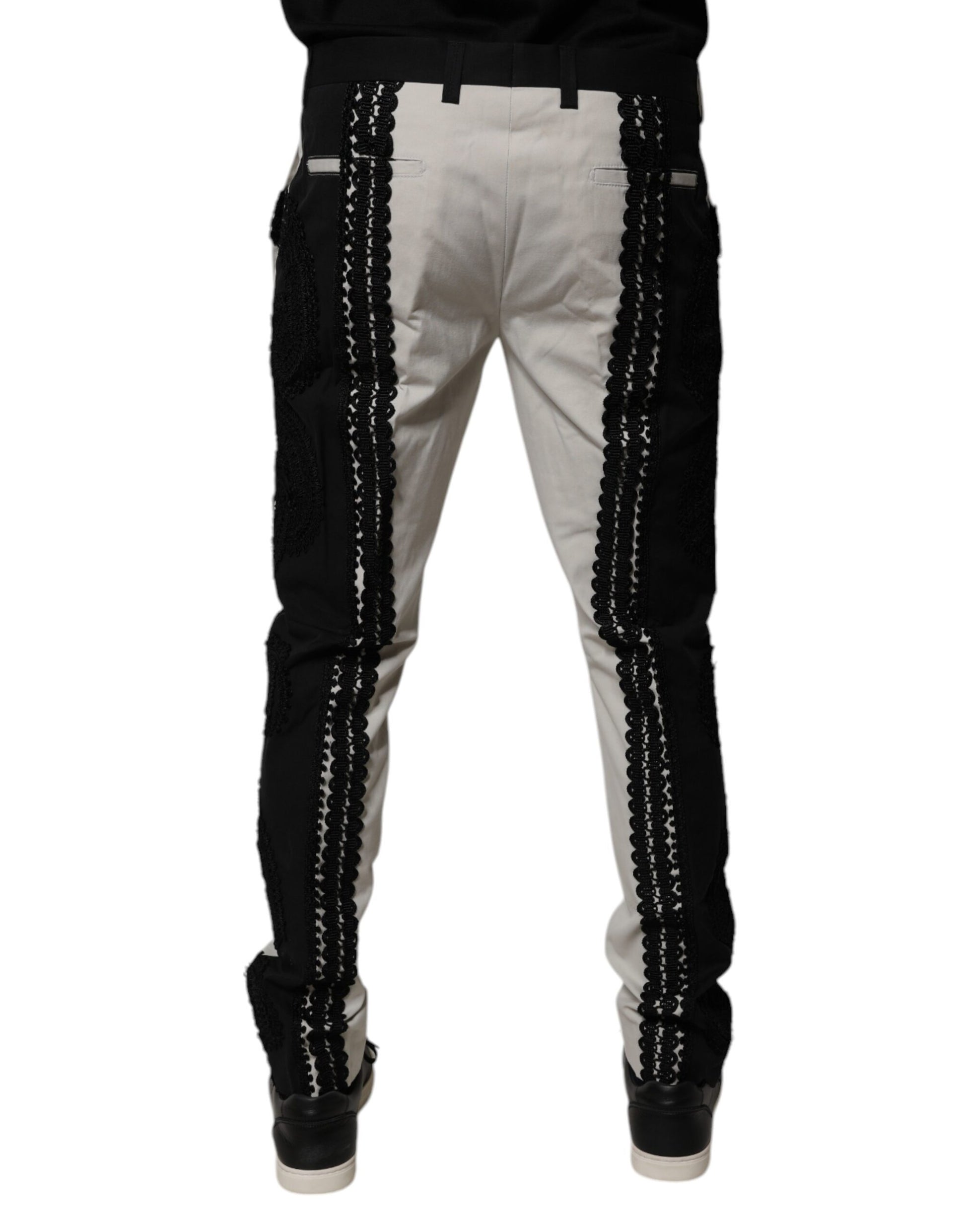 A pair of white lace trim mid waist dress pants from Dolce & Gabbana