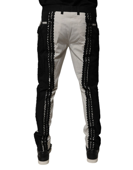 A pair of white lace trim mid waist dress pants from Dolce & Gabbana