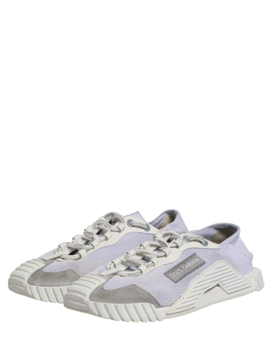 Pair of light grey sneakers with white laces