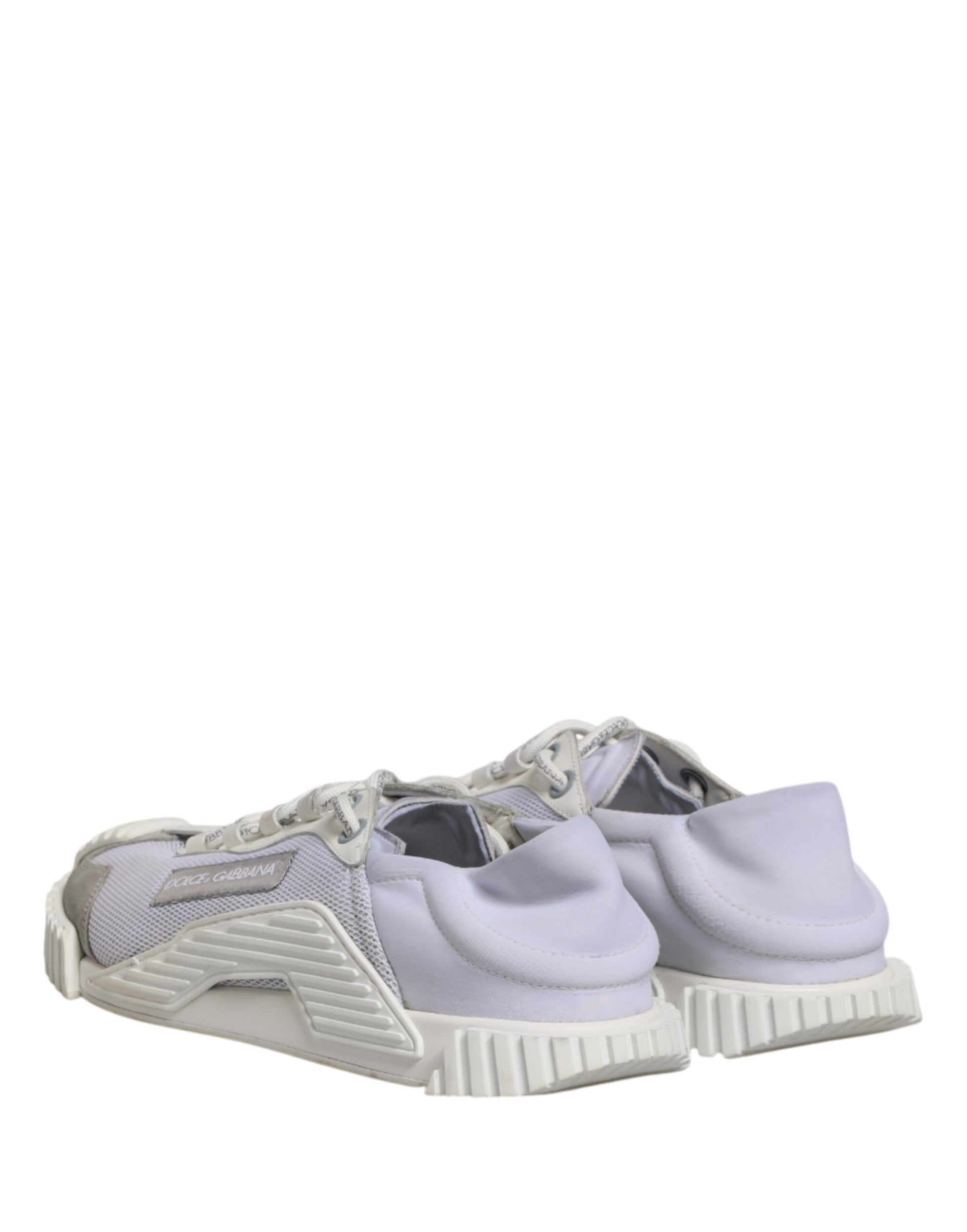 Pair of light purple athletic shoes with white laces