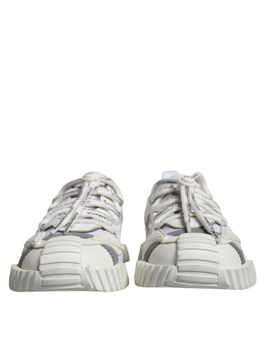 Pair of white lace-up sneakers with low top, featuring a textured design on the side
