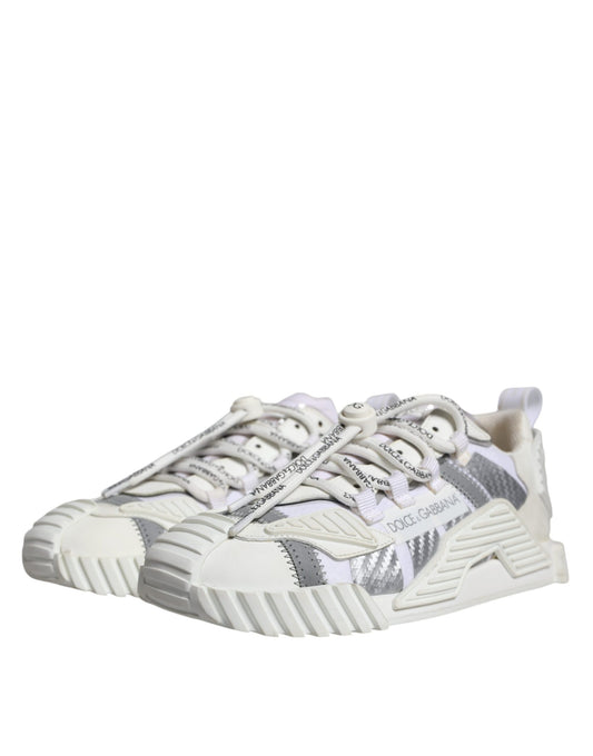 A pair of white lace-up sneakers with a low top, featuring a patterned design on the side