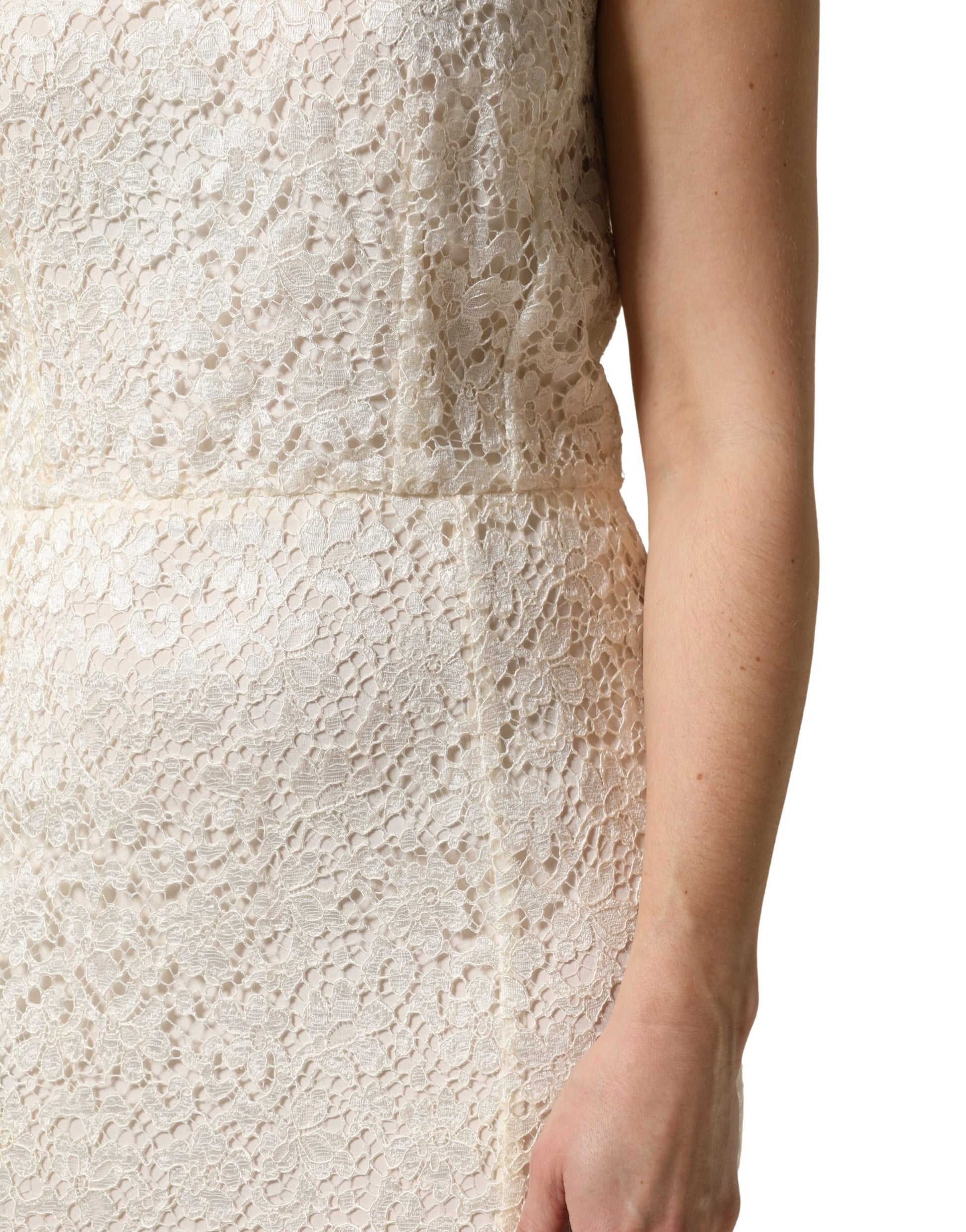 A white lace dress with a viscose sheath and long sleeves