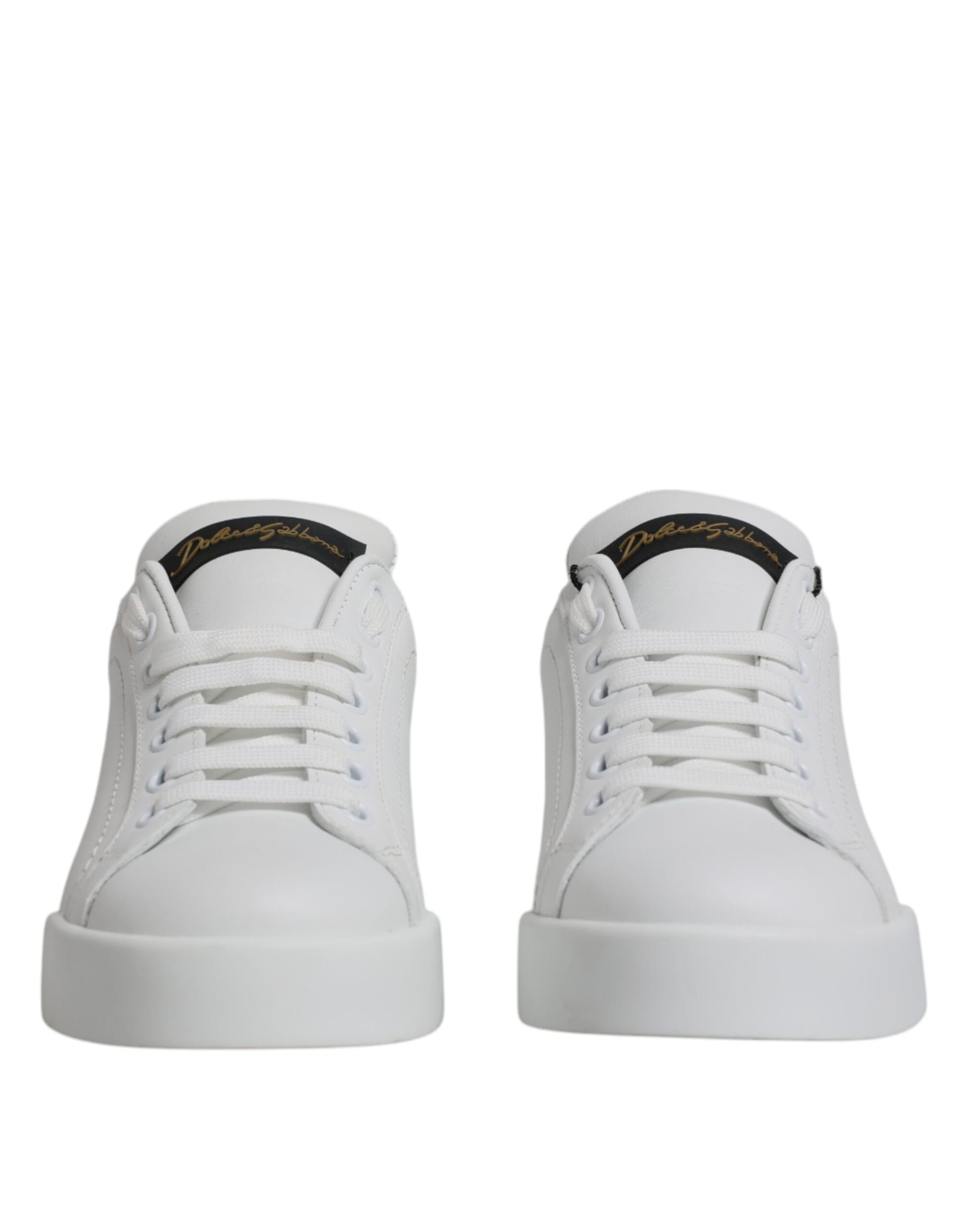Pair of white sneakers with black laces and a small logo on the side