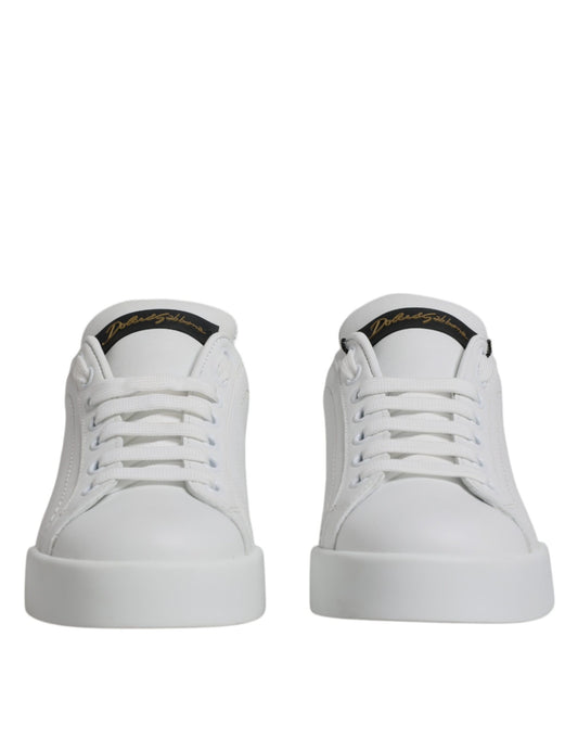 Pair of white sneakers with black laces and a small logo on the side