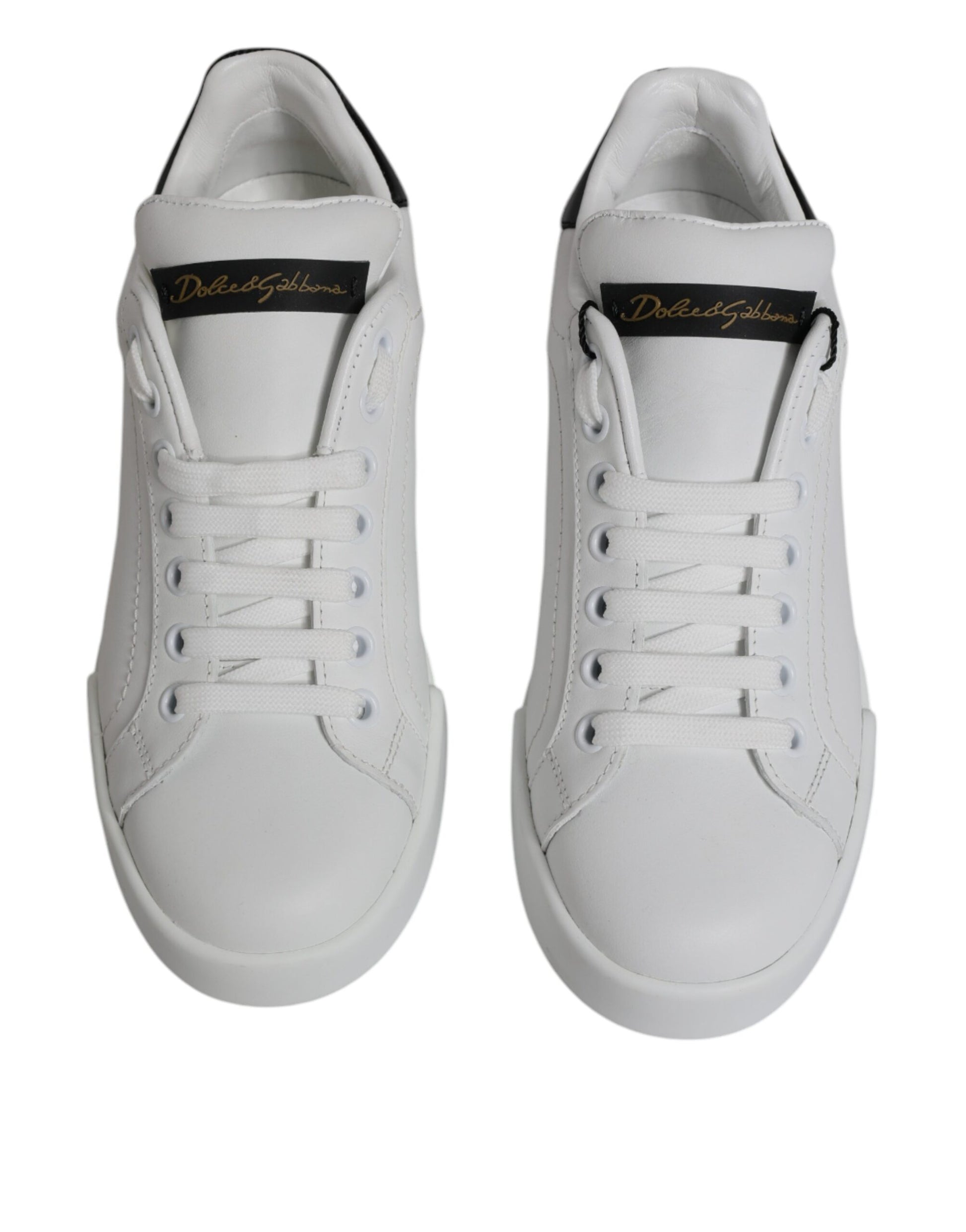 Pair of white sneakers with black laces and a logo on the side