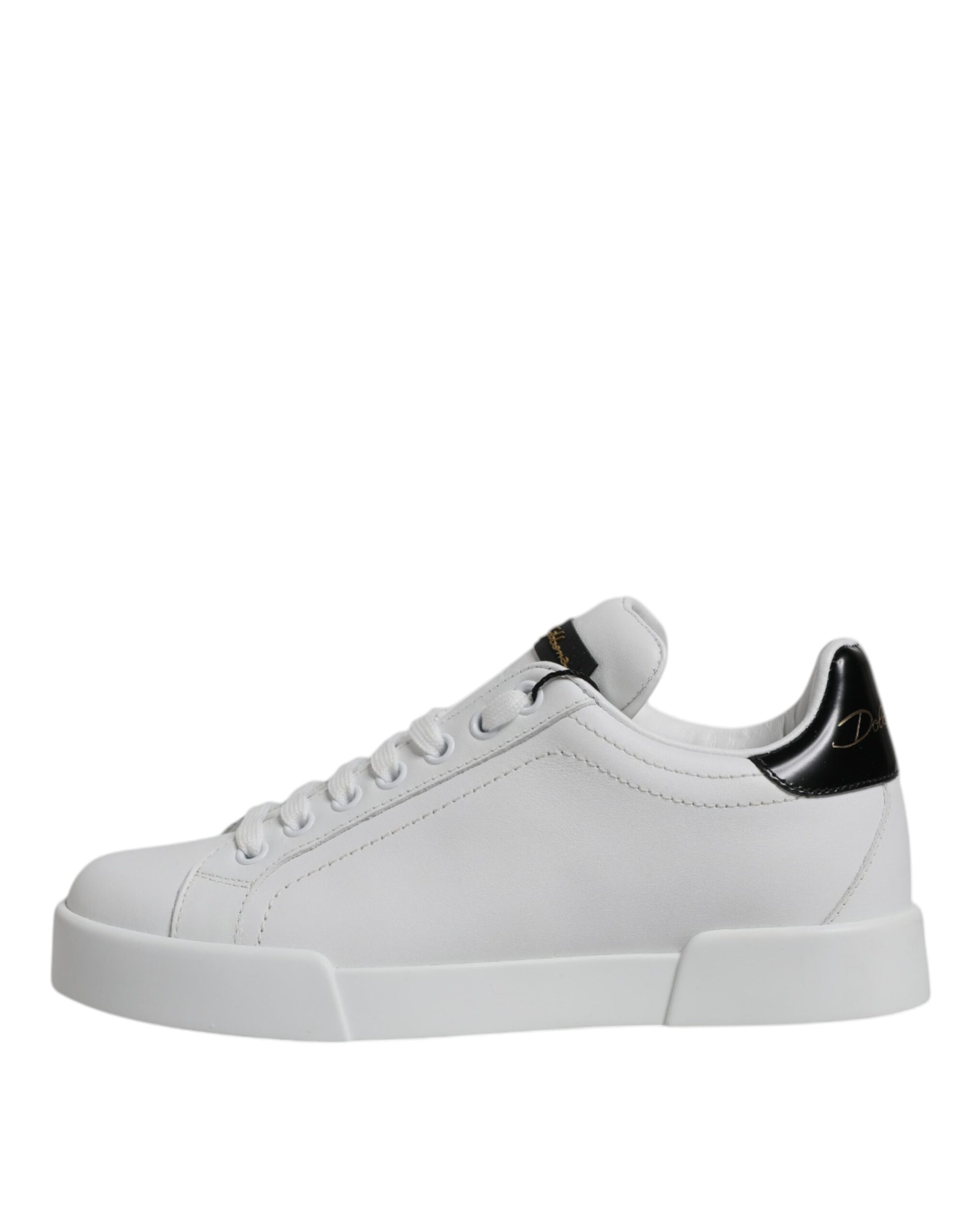 White sneaker with black laces and gold accents on side panels