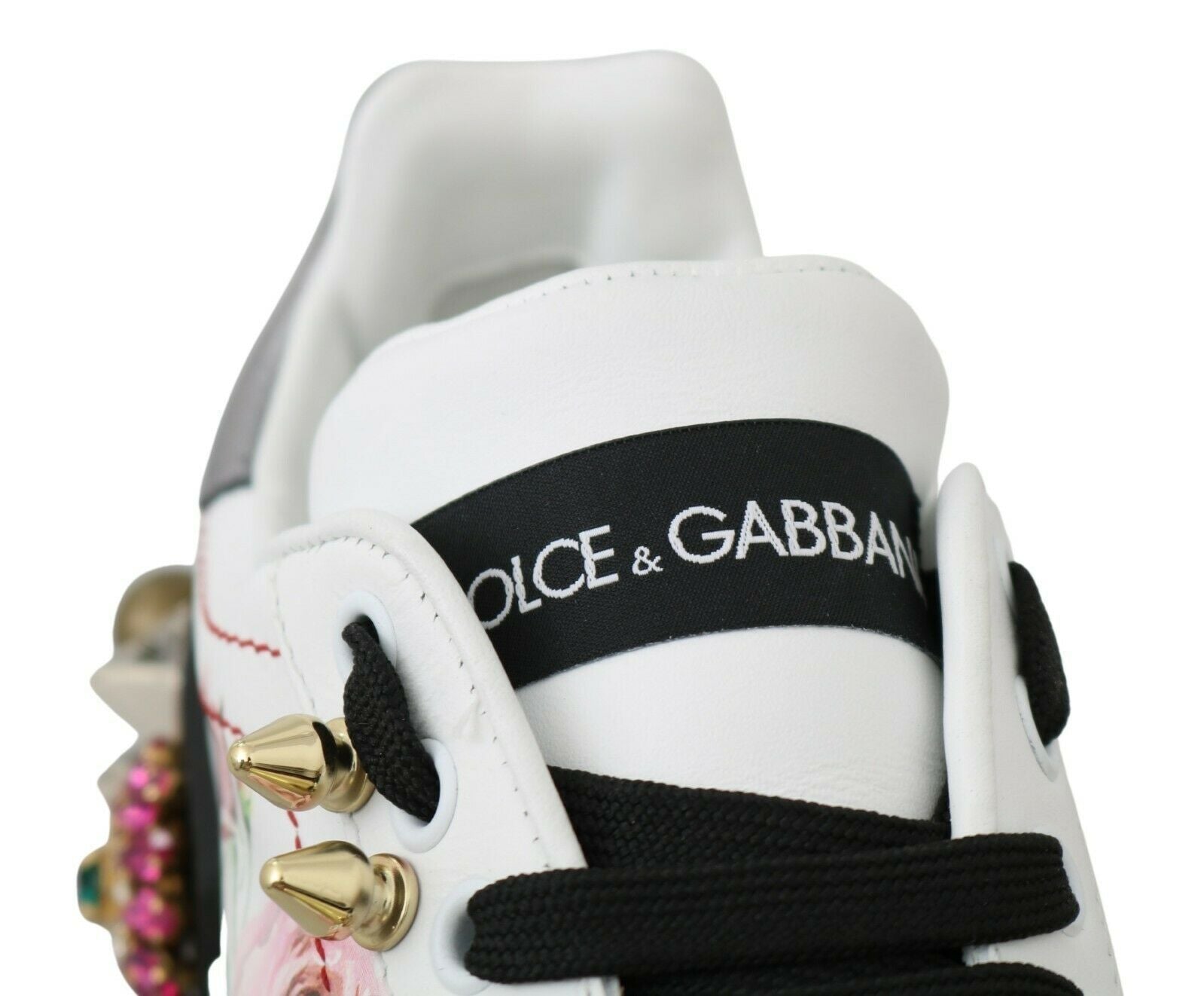 White sneaker with black and gold accents, featuring a logo on the side reading GABBANI