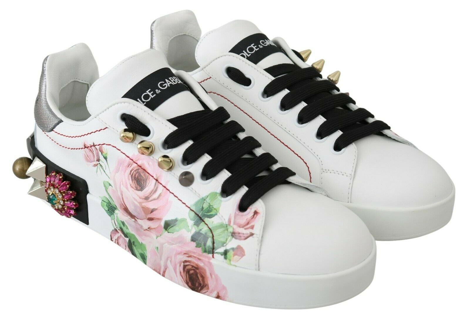Pair of sneakers with floral print and gold accents