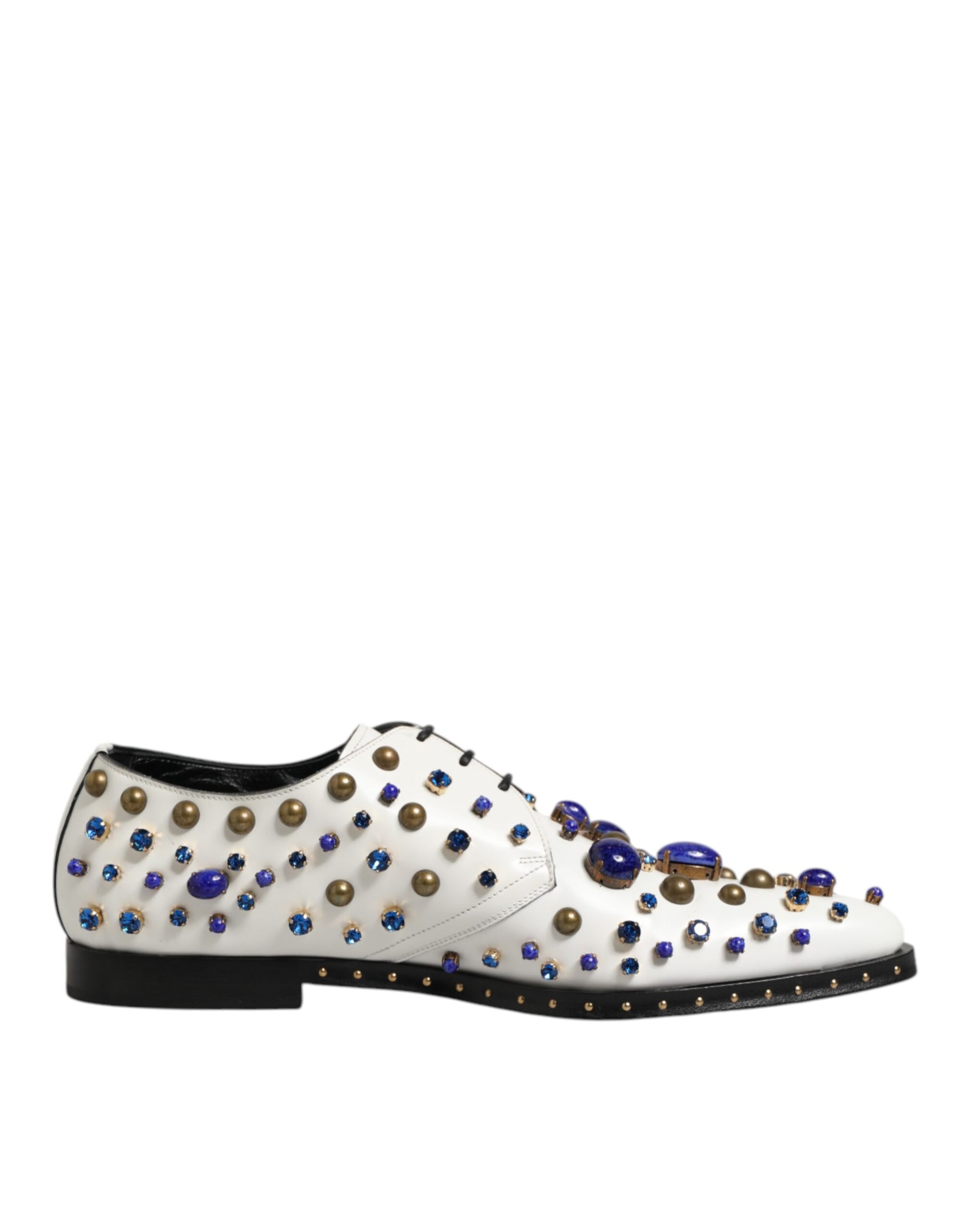 A pair of white leather shoes with blue crystal embellishments on the toe and heel