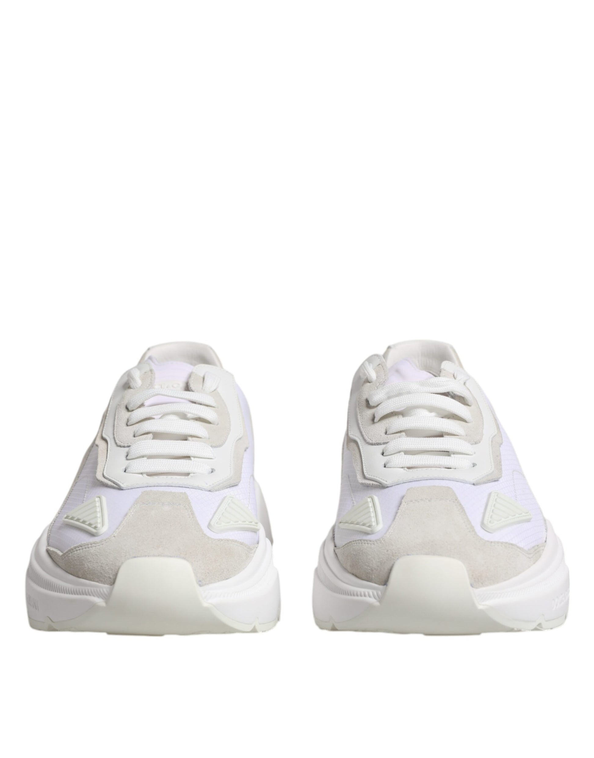 Pair of white leather sneakers with pink accents, featuring a low top design and laces