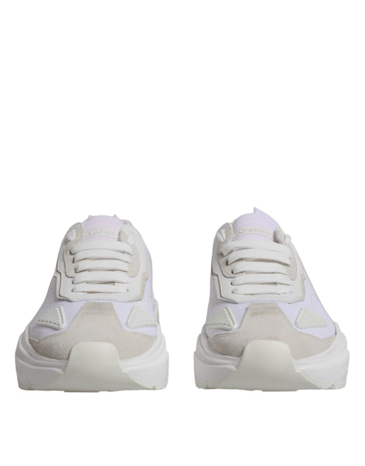 Pair of light pink sneakers with white laces and soles