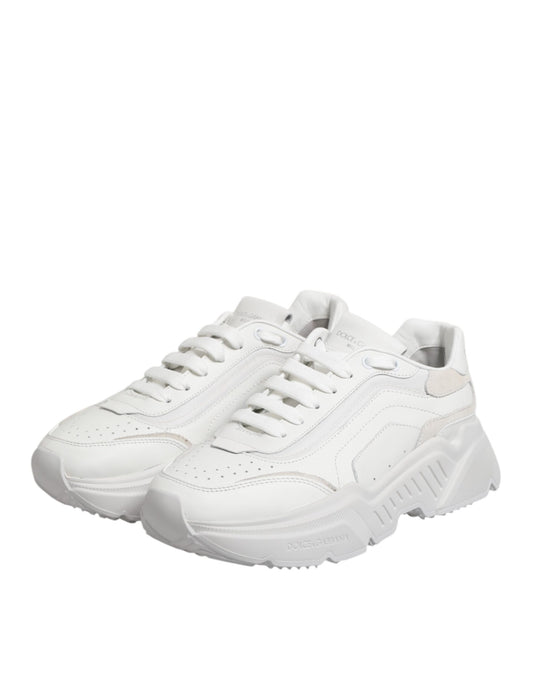 White leather sneakers with laces, featuring a low top and a logo on the side