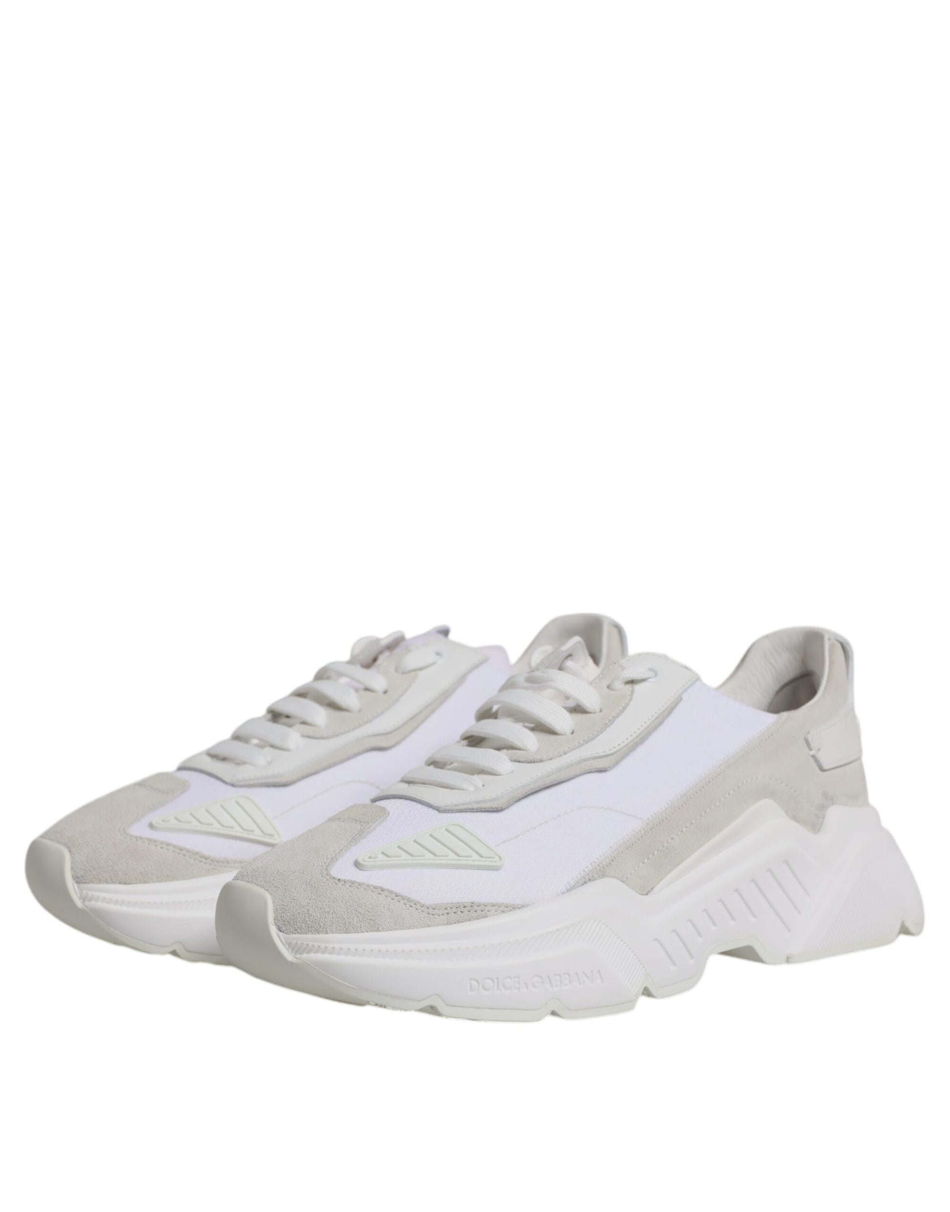 Pair of white leather sneakers with laces, featuring a low top design and a logo on the side