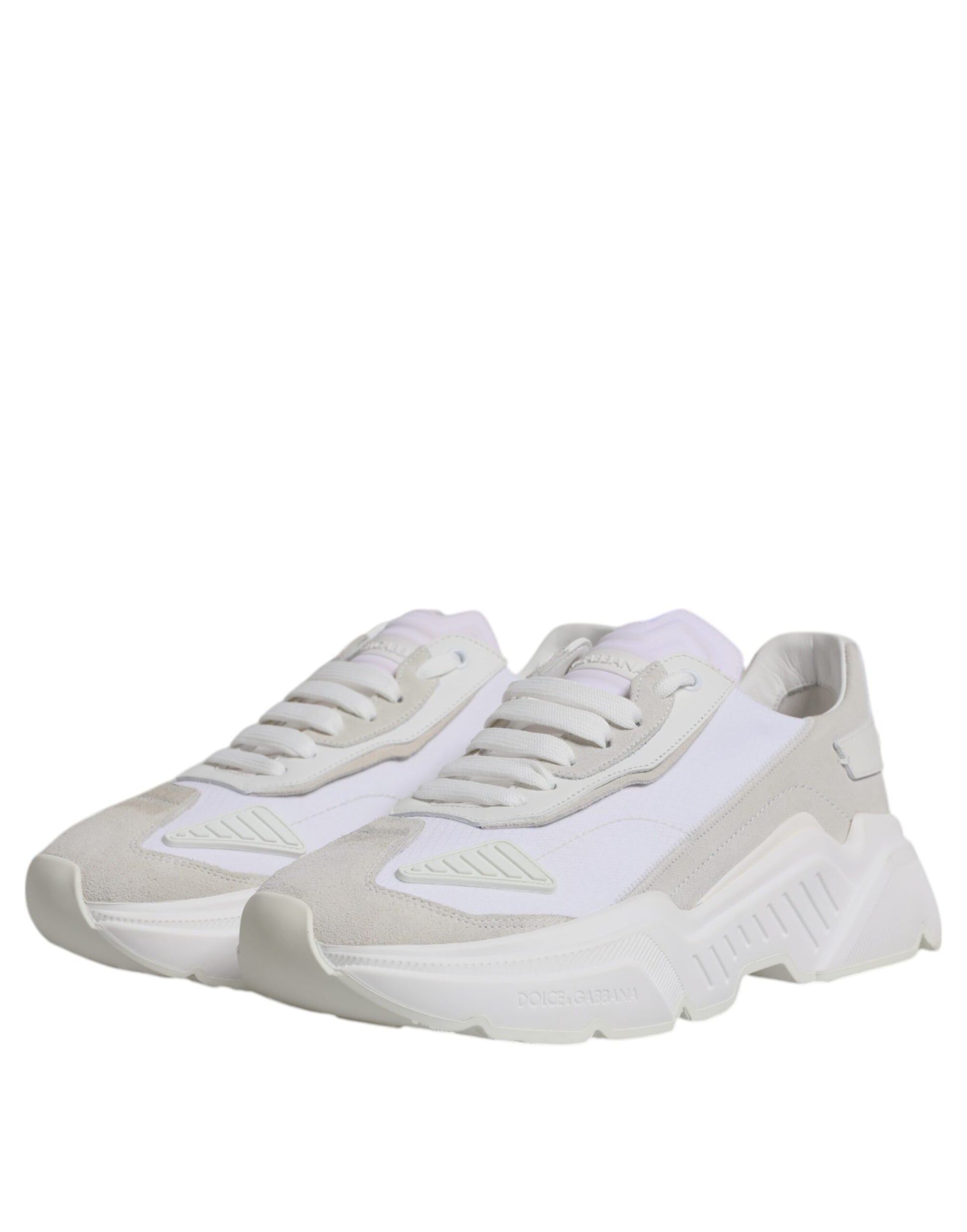 Pair of light beige sneakers with white laces and soles