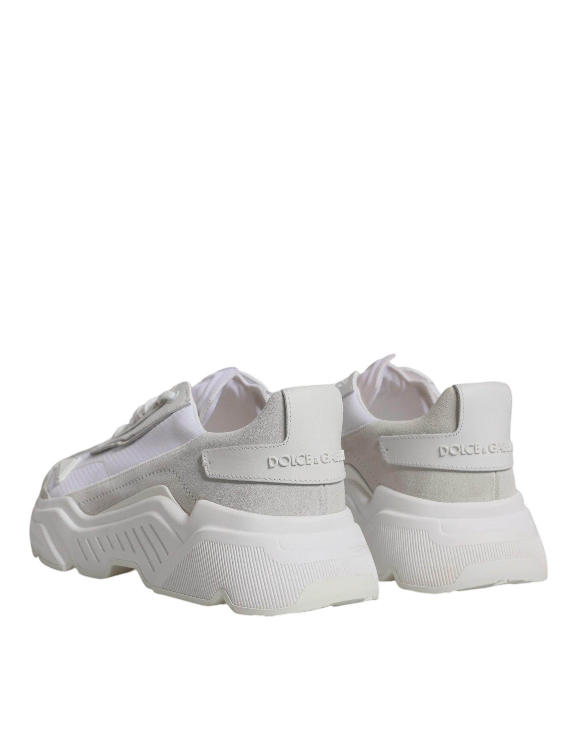 Pair of white sneakers with black laces and a logo on the side