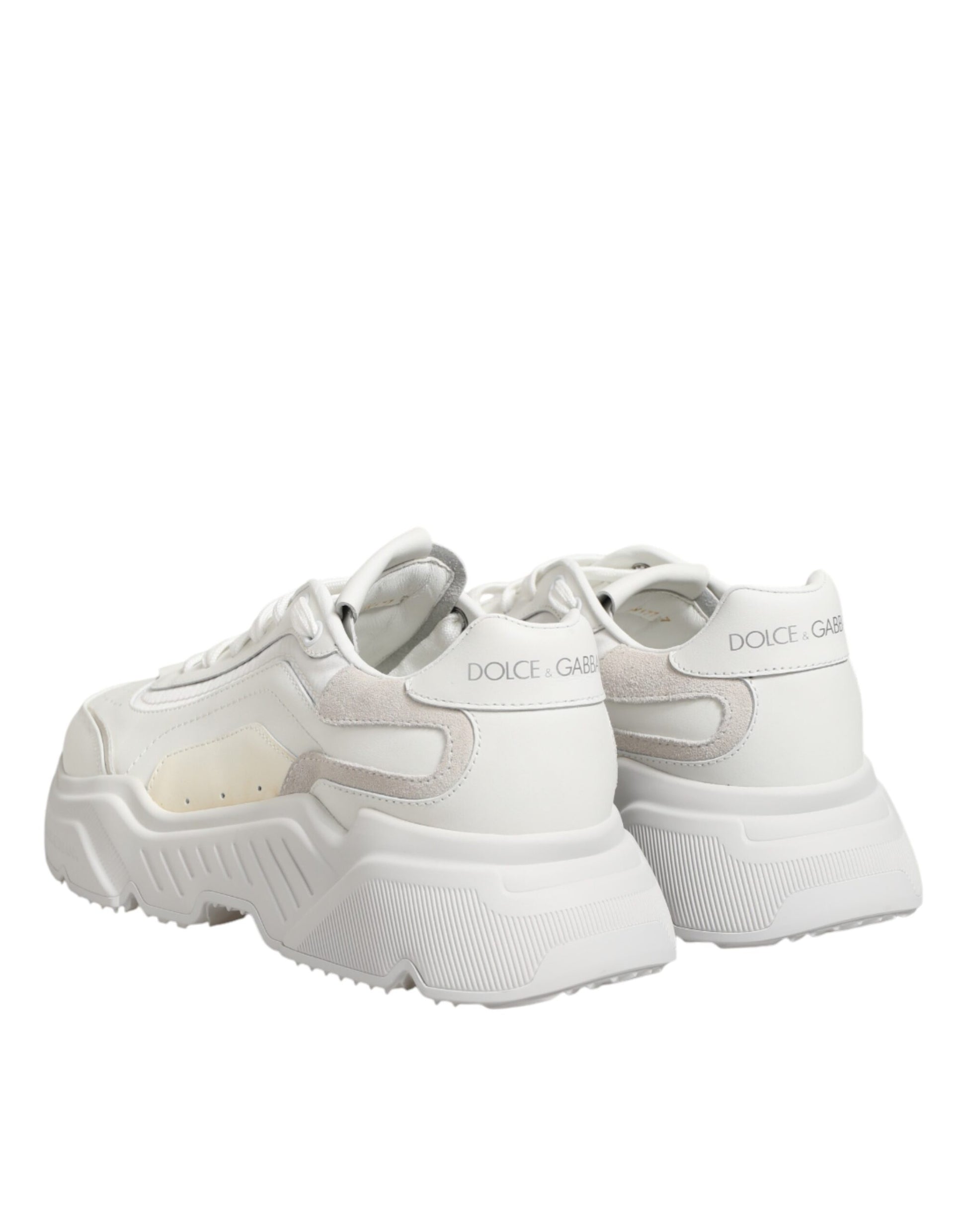 Pair of white sneakers with tan accents