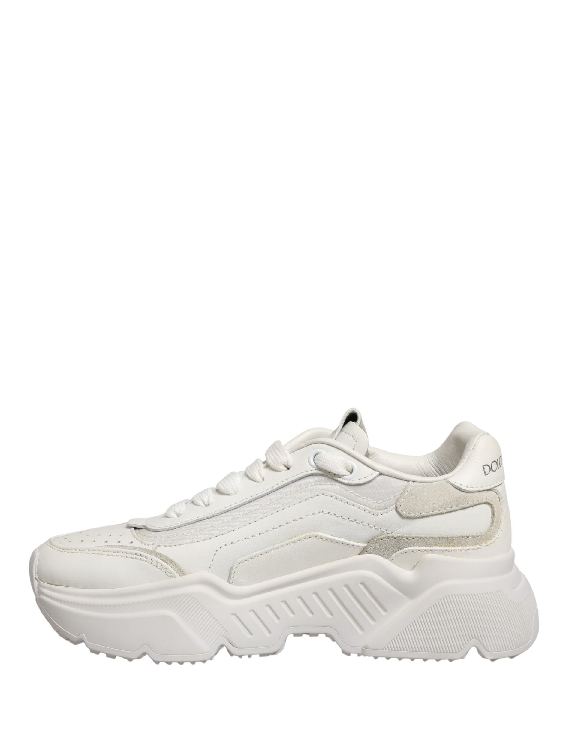 A pair of white leather sneakers with a low top, featuring a lace-up front and a chunky sole
