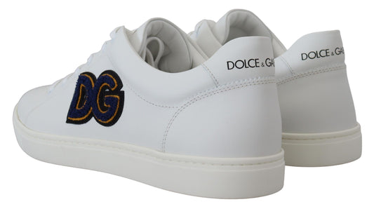 White sneakers with gold logo on side and sole