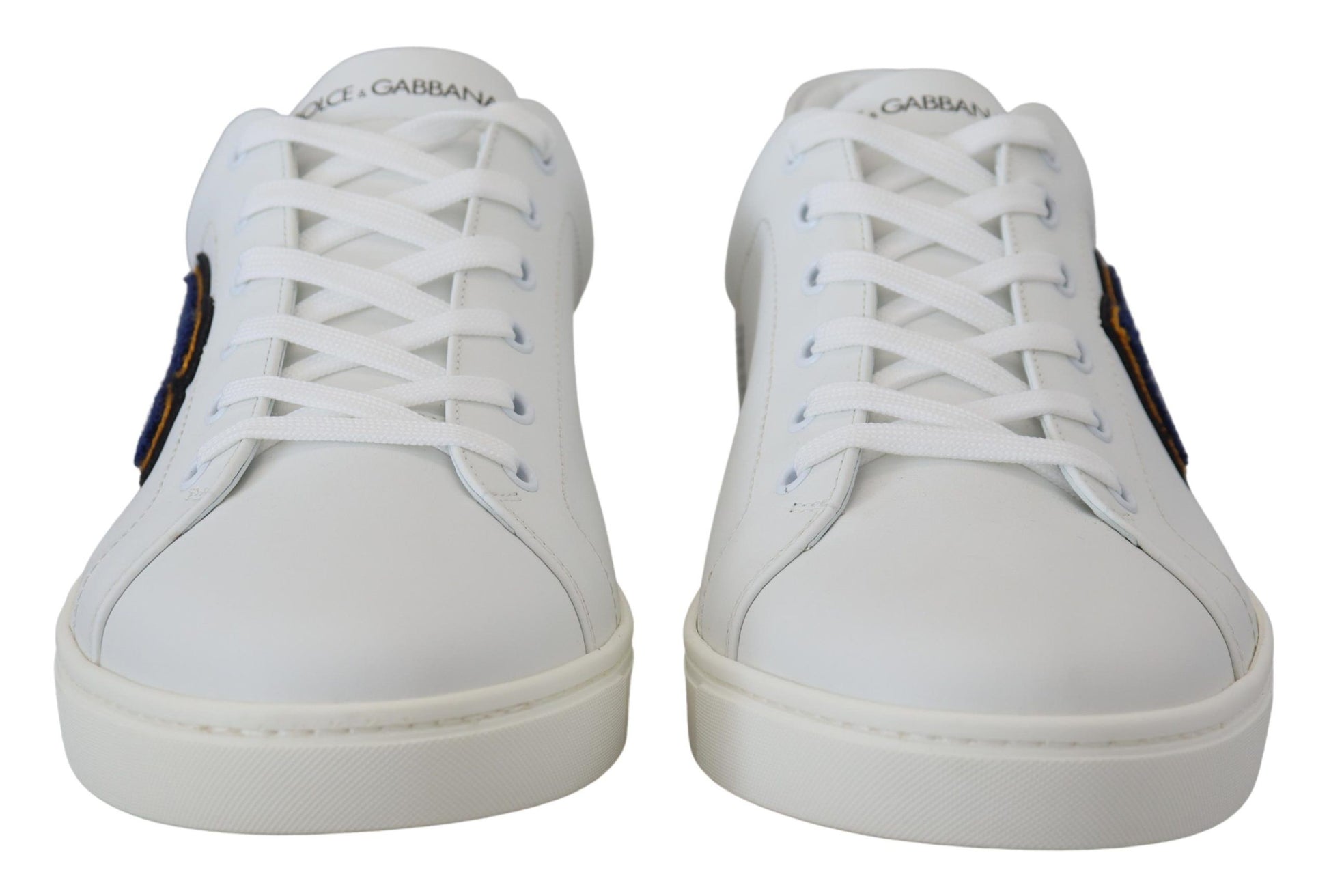 Pair of white sneakers with laces and a logo on the side