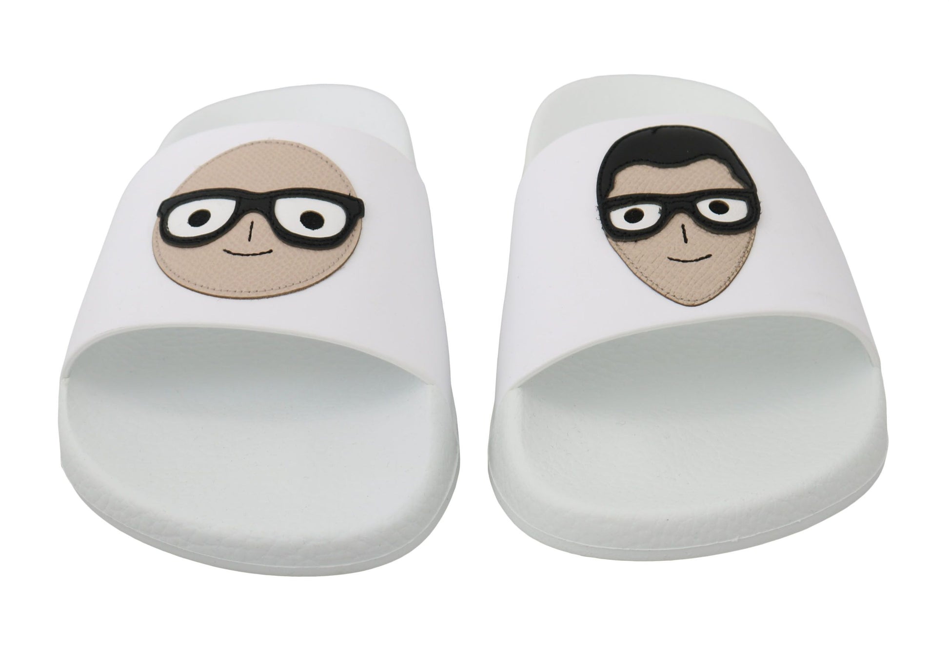 Two slippers with cartoon faces on them
