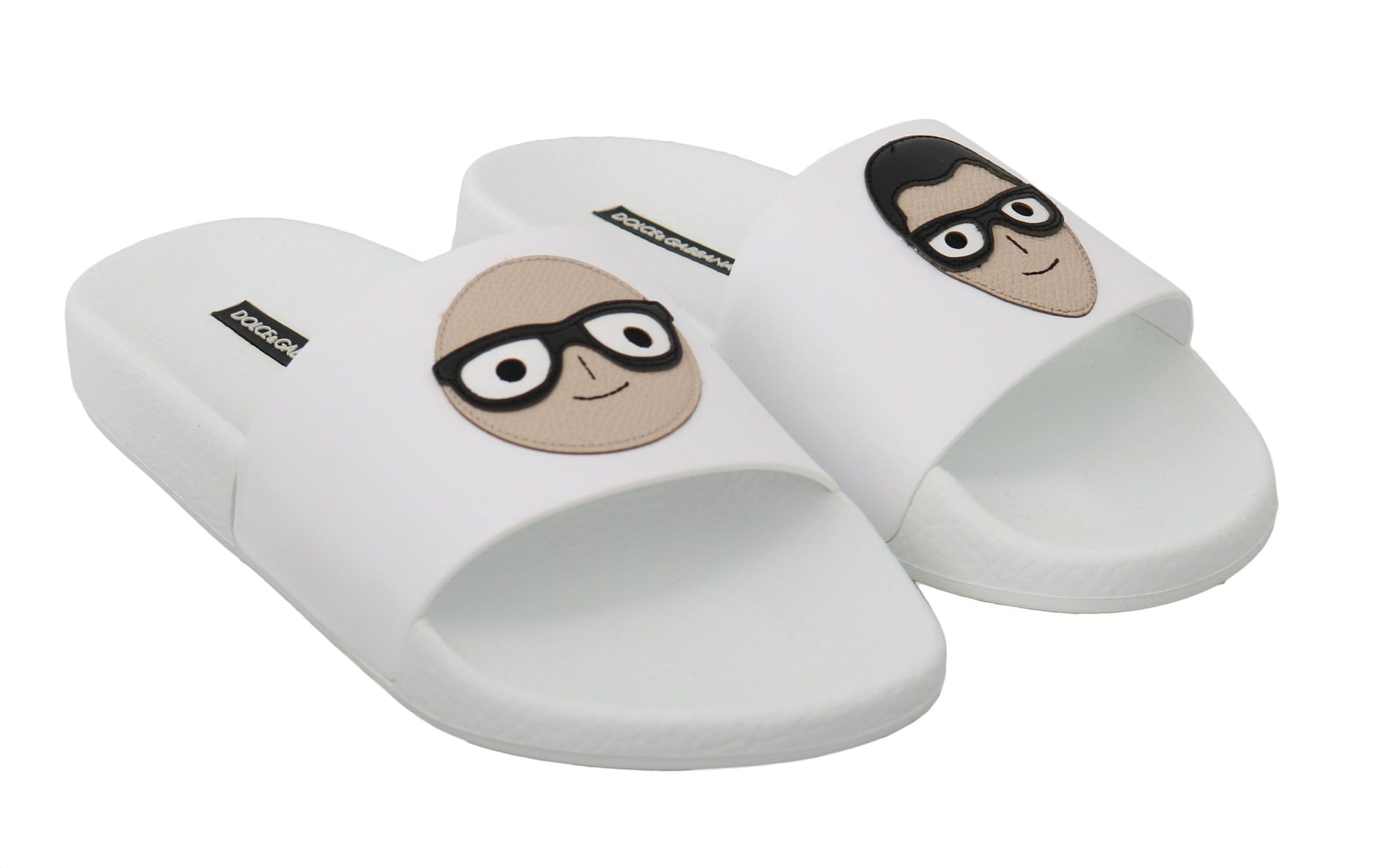 Pair of slippers with cartoon character designs on them